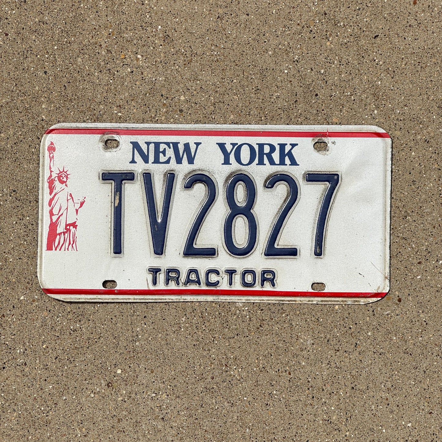 Photo of a 1986 New York Tractor License Plate Auto Tag Garage Decor Vintage TV 2827