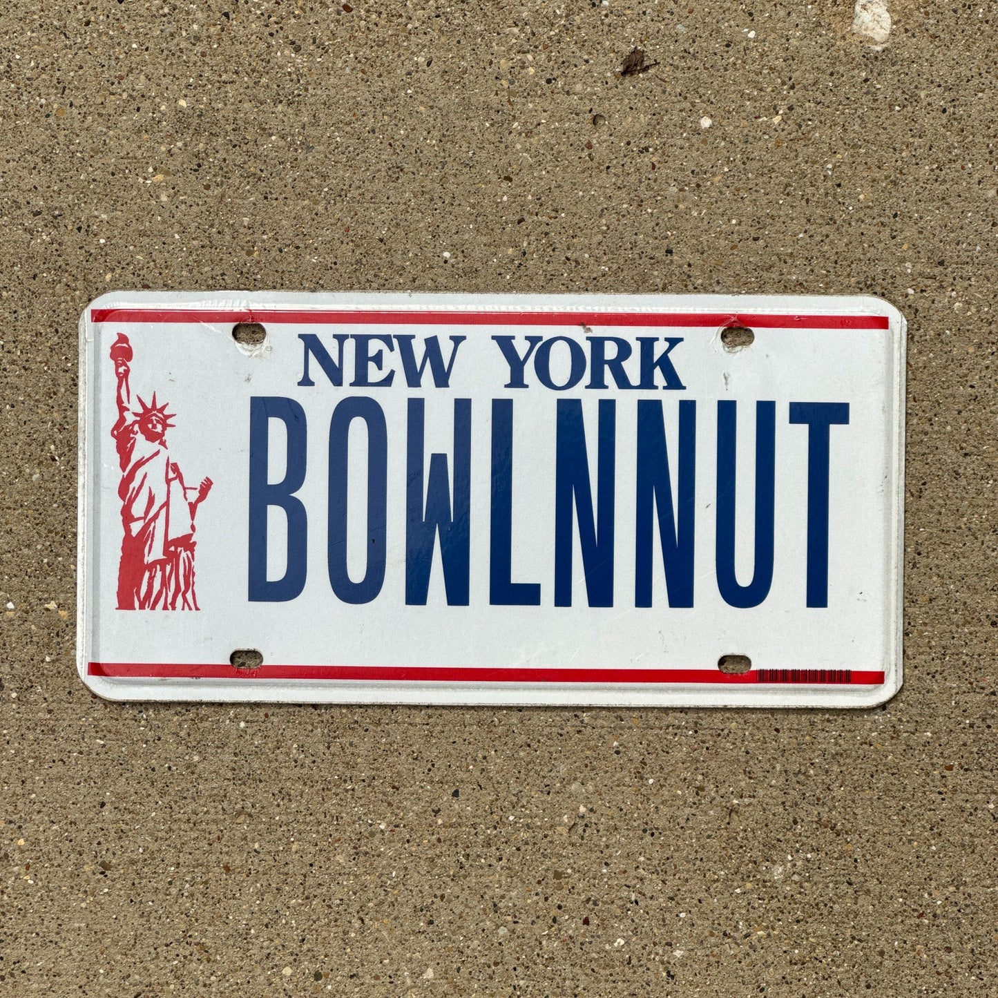 Photo of a 1986 New York Vanity License Plate Auto Tag Garage Decor Vintage Bowling BOWL N NUT