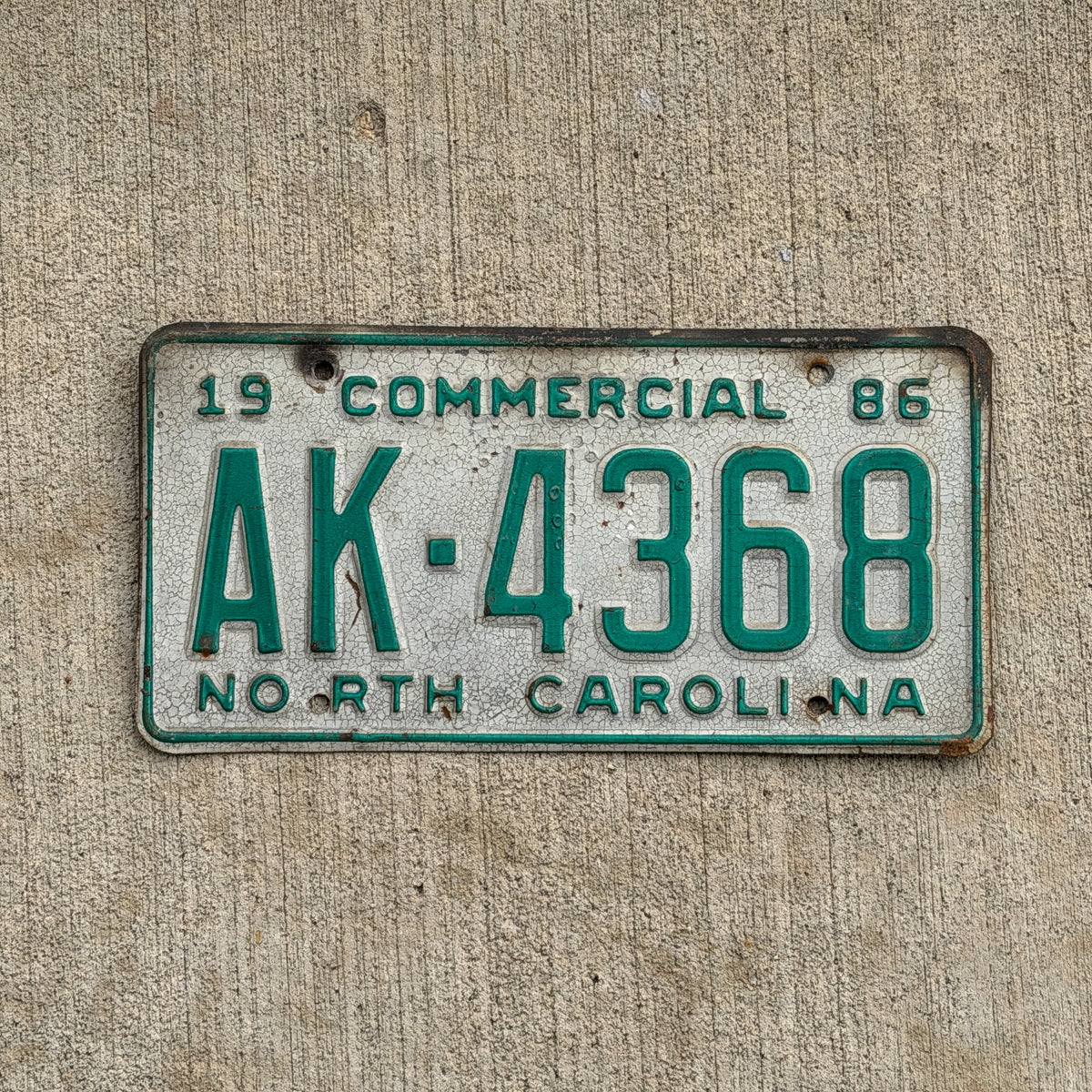 Photo of a 1986 North Carolina Commercial License Plate Auto Tag Garage Decor Vintage AK 4368 with original patina