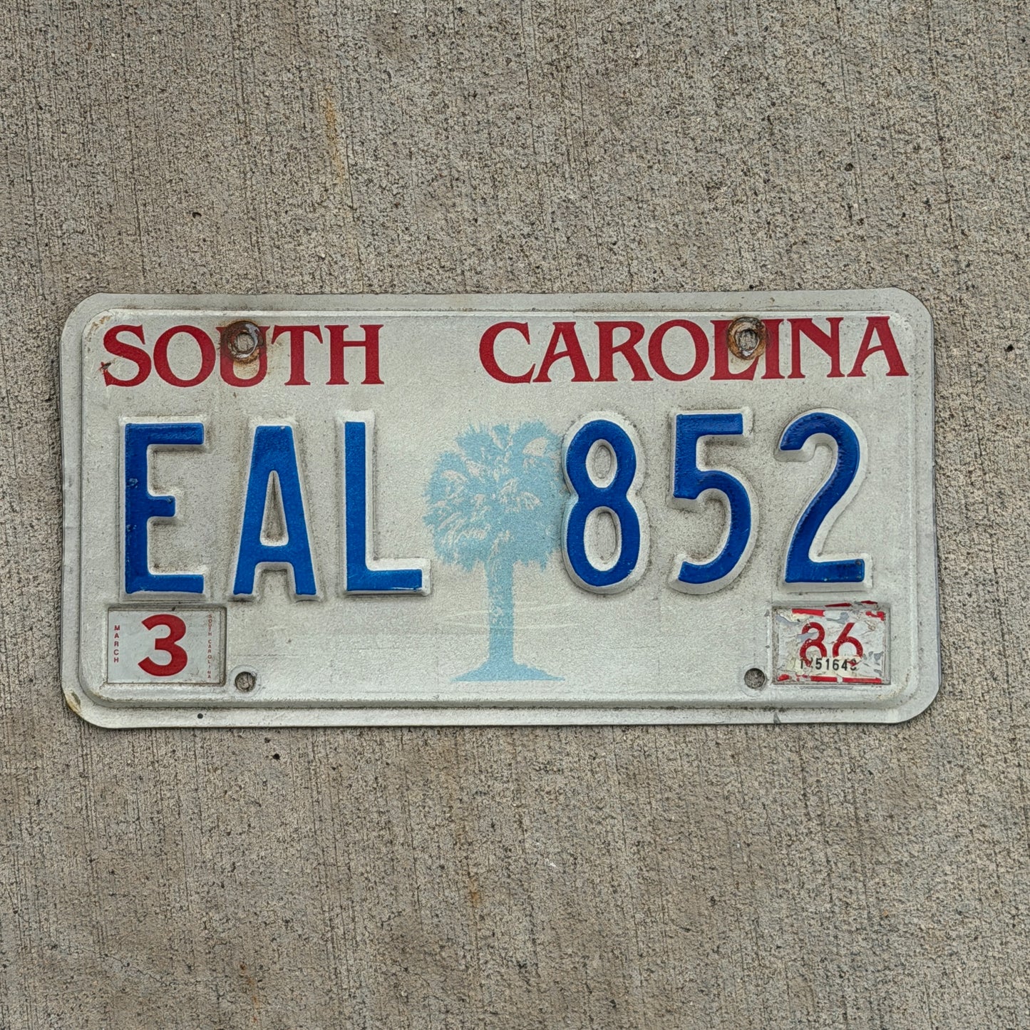 Photo of a 1986 South Carolina License Plate Auto Tag Garage Decor Vintage EAL 852 with original patina