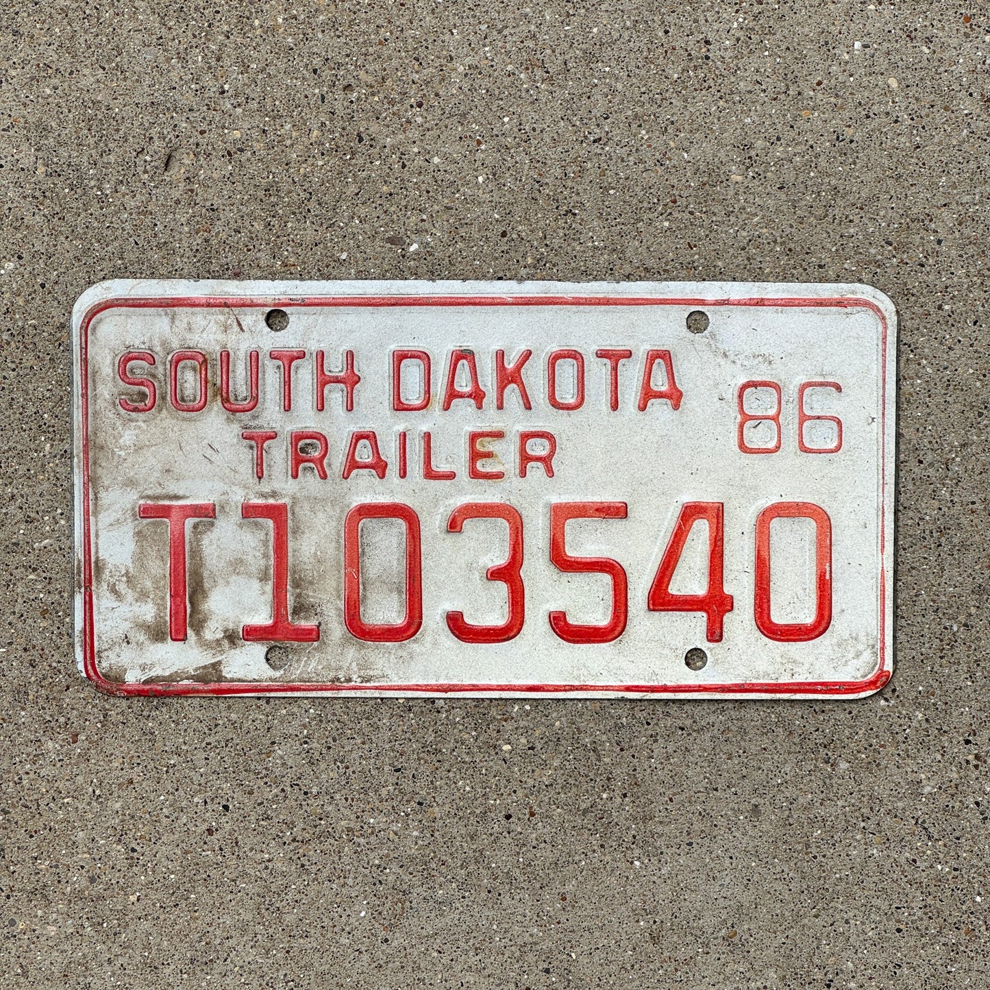 Photo of a 1986 South Dakota Trailer License Plate Auto Tag Garage Decor Vintage T 103540