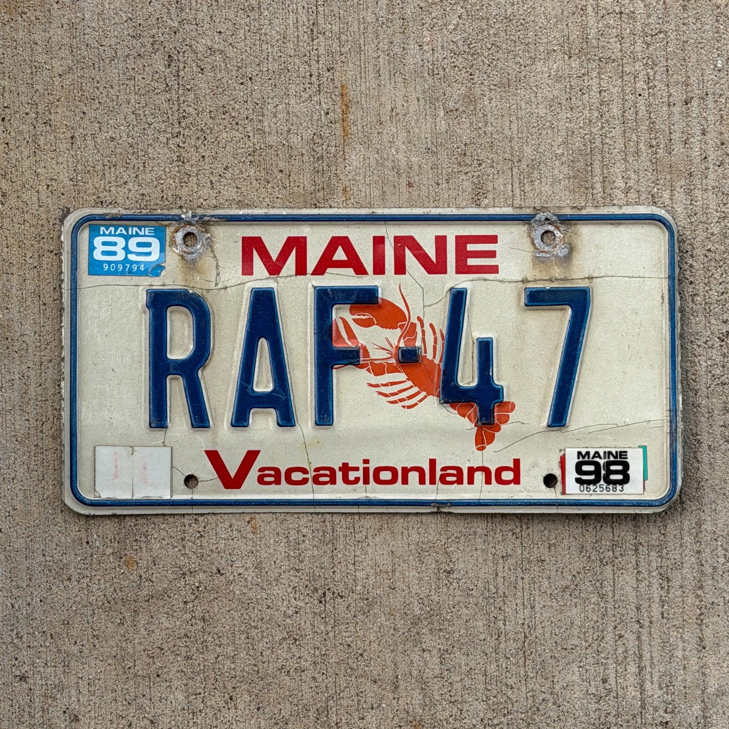 Photo of a 1987 1998 Maine Vanity License Plate Auto Tag Garage Decor Vintage Lobster RAF 47 with original patina