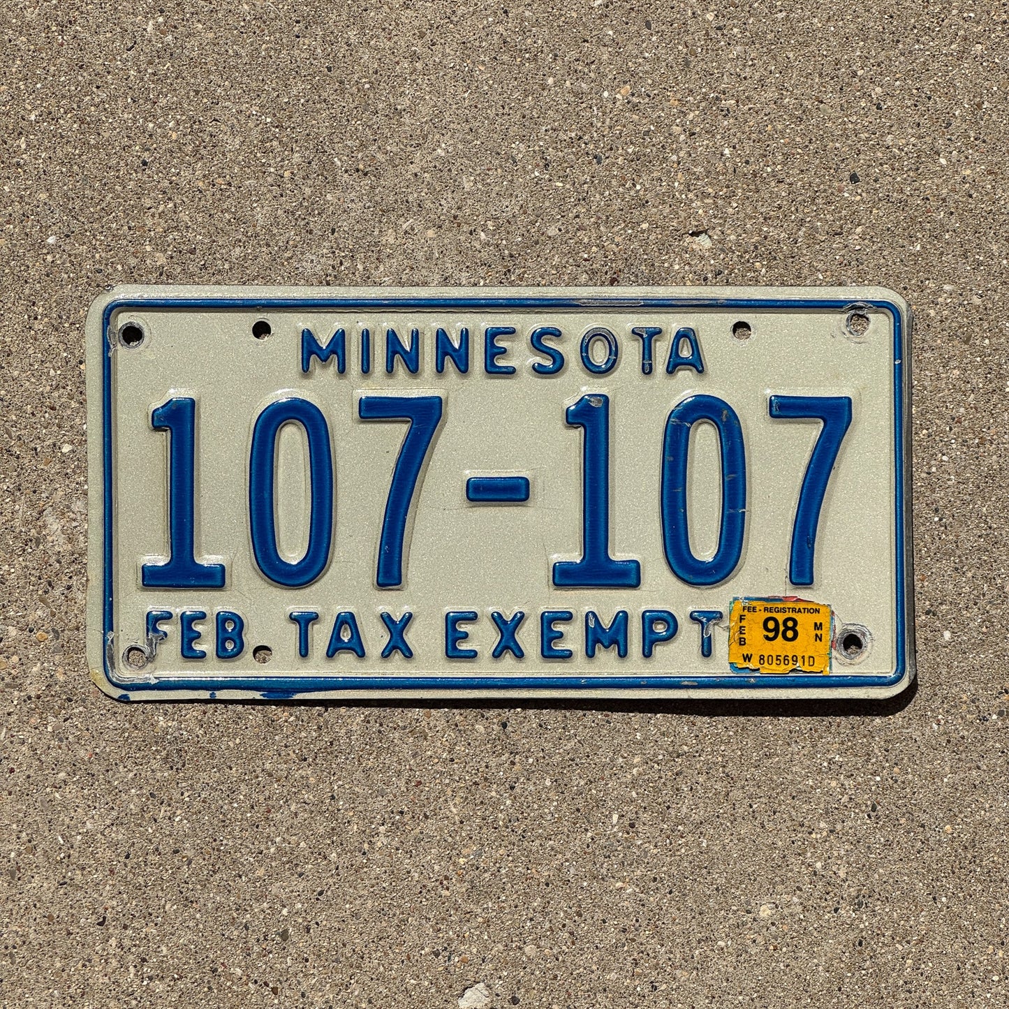 Photo of a 1987 1998 Minnesota Tax Exempt License Plate Auto Tag 1 Garage Decor Repeat Repeating 107 107