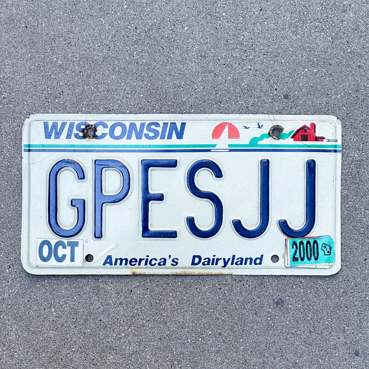 Photo of a 1987 2000 Wisconsin Vanity License Plate Auto Tag 1 Vintage Garage GPES JJ with original patina