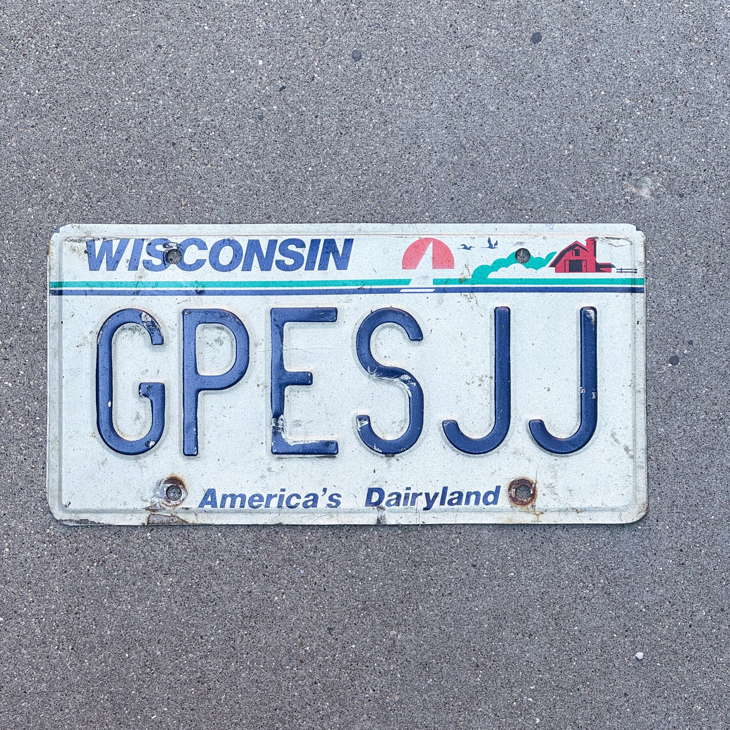 Photo of a 1987 2000 Wisconsin Vanity License Plate Auto Tag 2 Vintage Garage GPES JJ with original patina