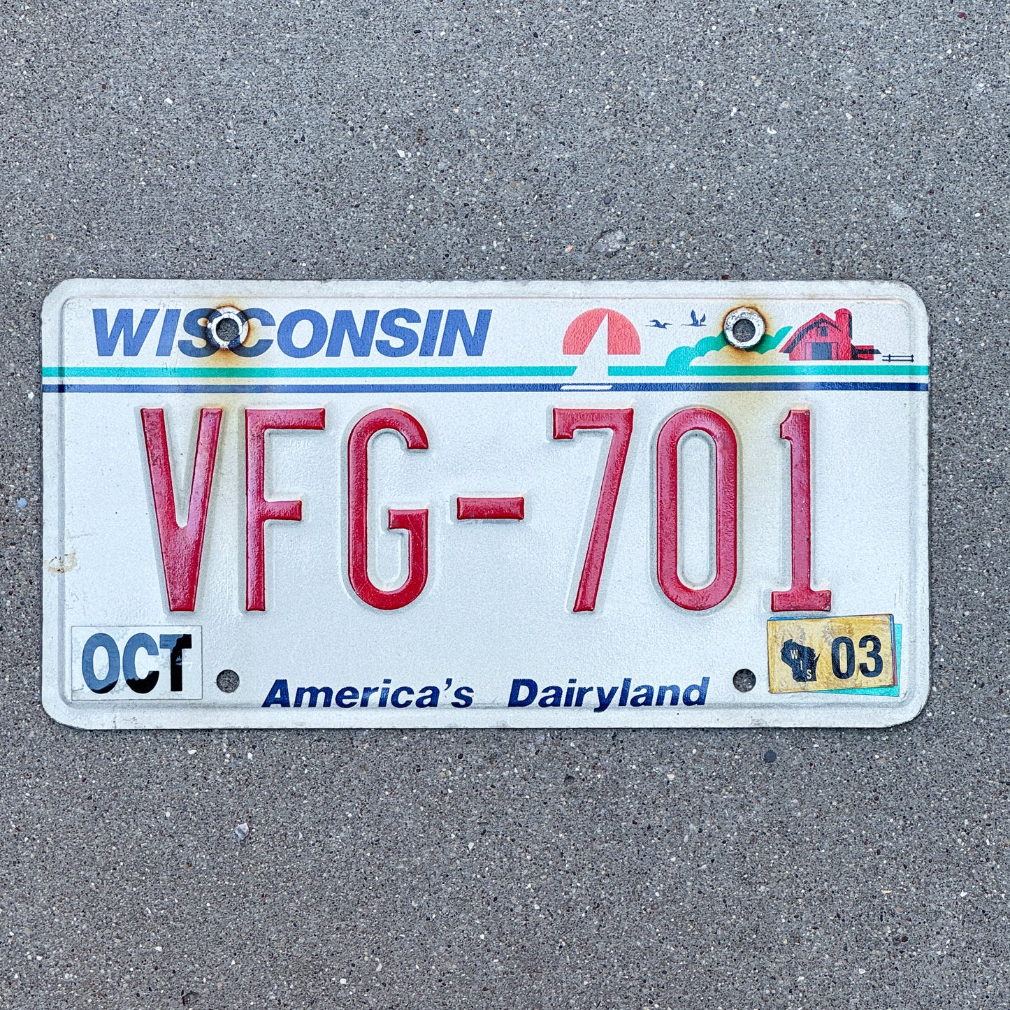 Photo of a 1987 2003 Wisconsin License Plate Auto Tag Garage Decor Vintage VFG 701 with original patina