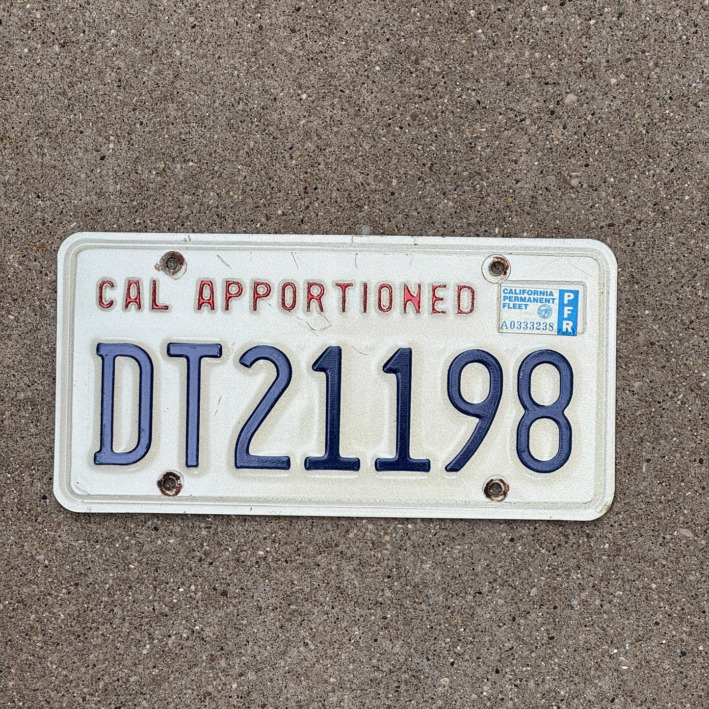 Photo of a 1987 California Apportioned License Plate Auto Tag Garage Decor Vintage DT 21198
