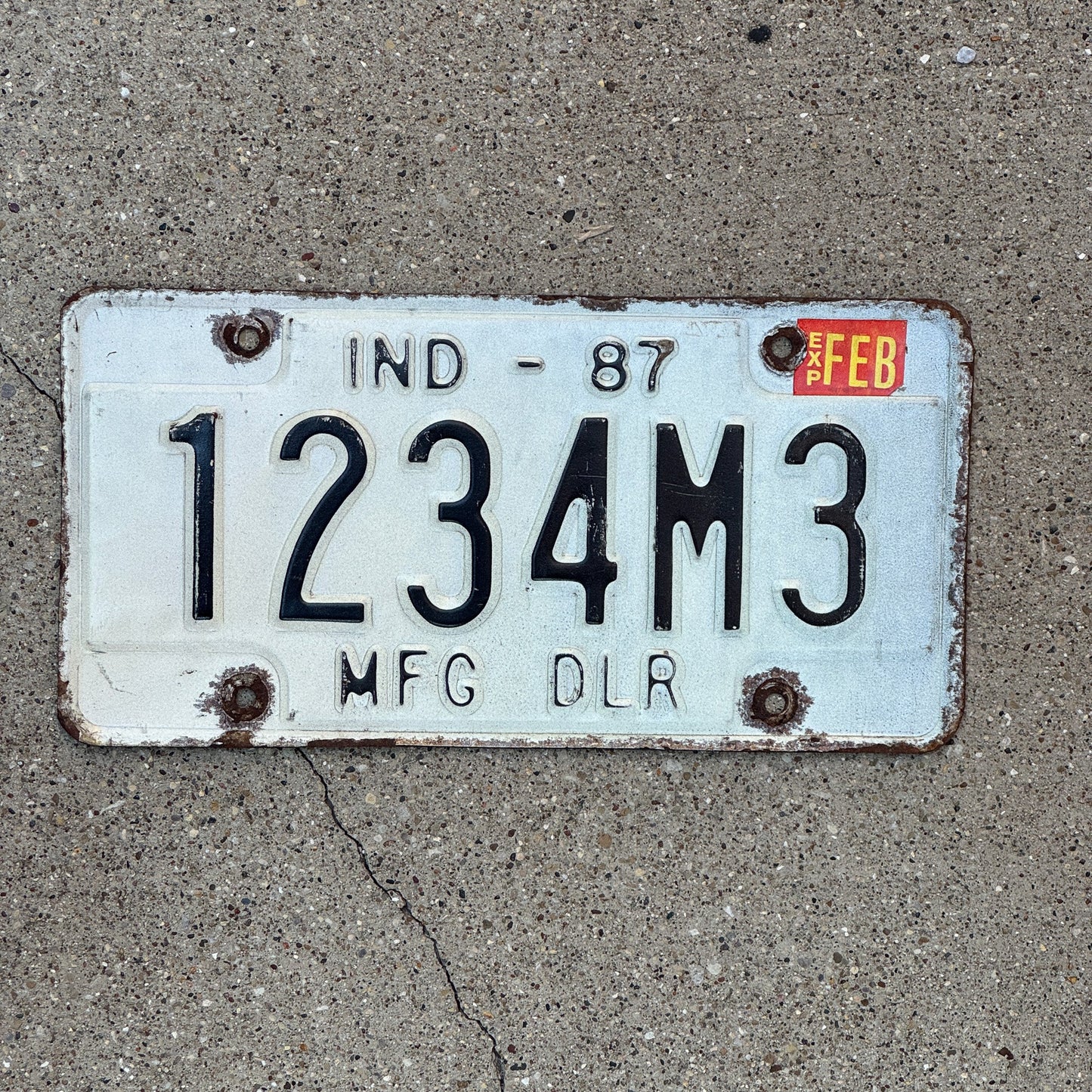 Photo of a 1987 Indiana Manufacturer Dealer License Plate Auto Tag Garage Decor Vintage 1234 M3
