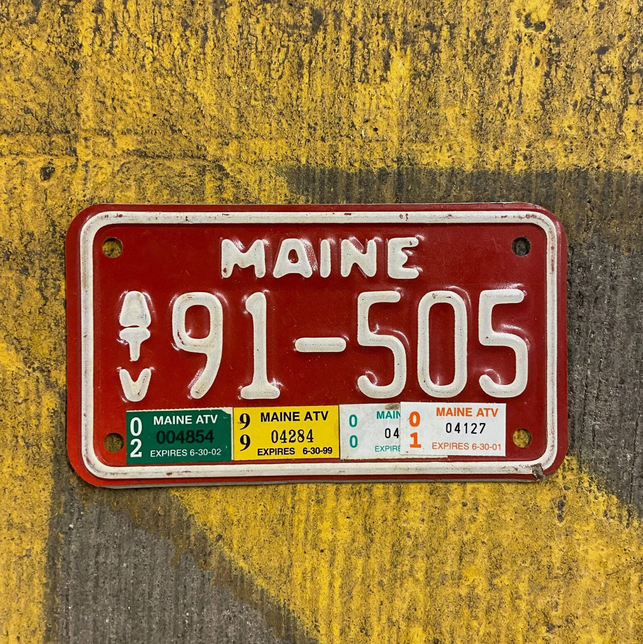 Photo of a 1987 Maine ATV License Plate Auto Tag Garage Decor Vintage Small Size Red 91 505