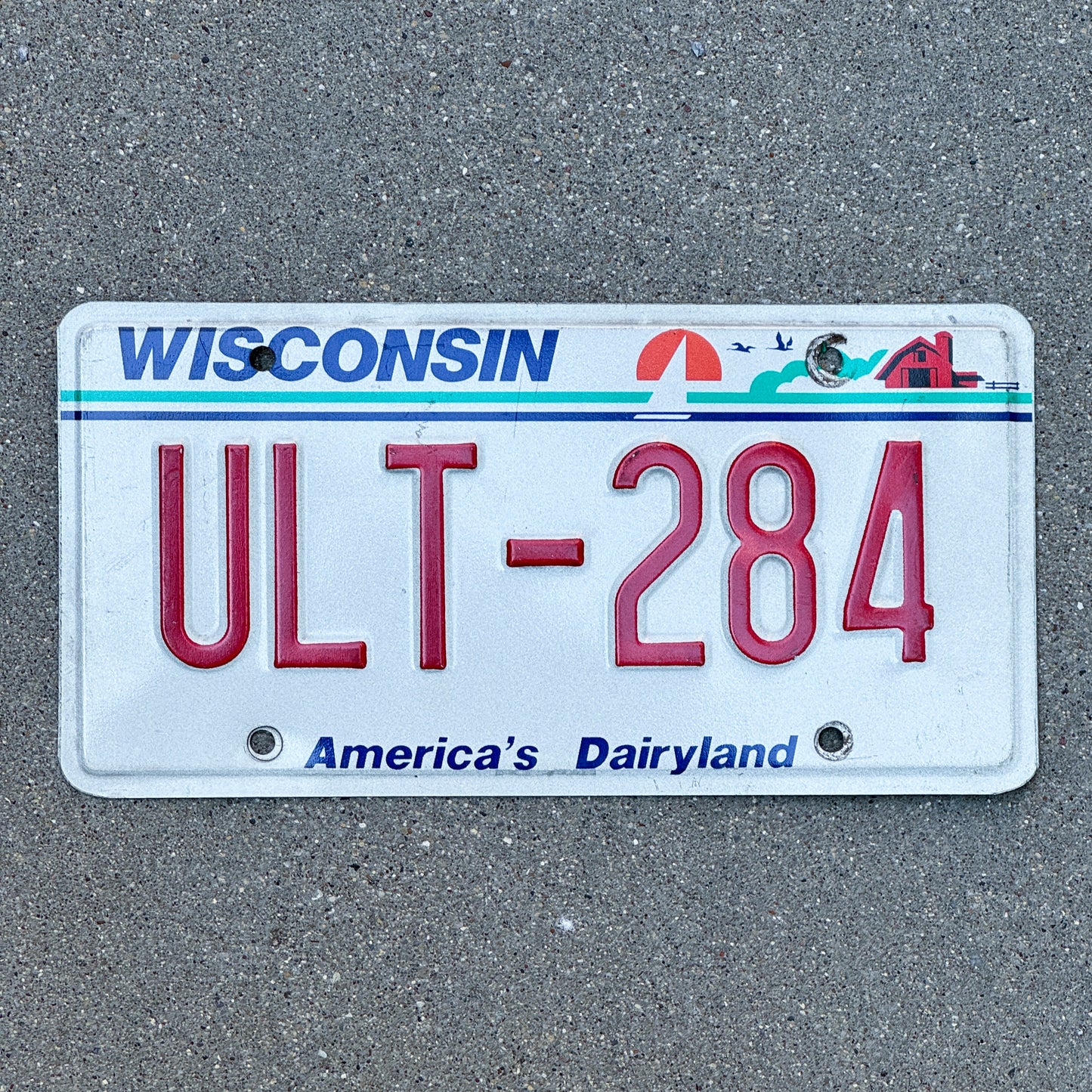 Photo of a 1987 Wisconsin License Plate Auto Tag Garage Decor Vintage ULT 284 with original patina
