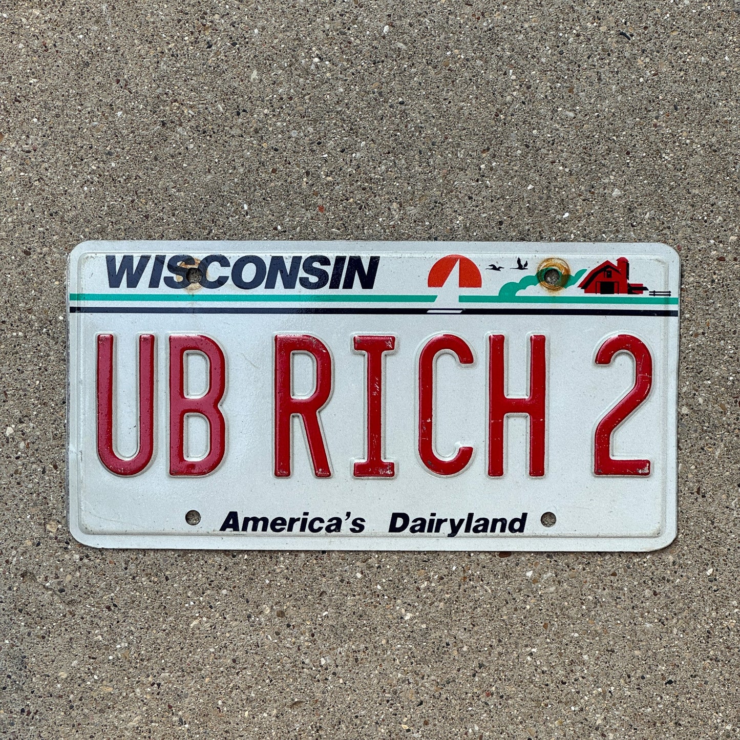 Photo of a 1987 Wisconsin Vanity License Plate Auto Tag Garage Decor Vintage UB RICH 2