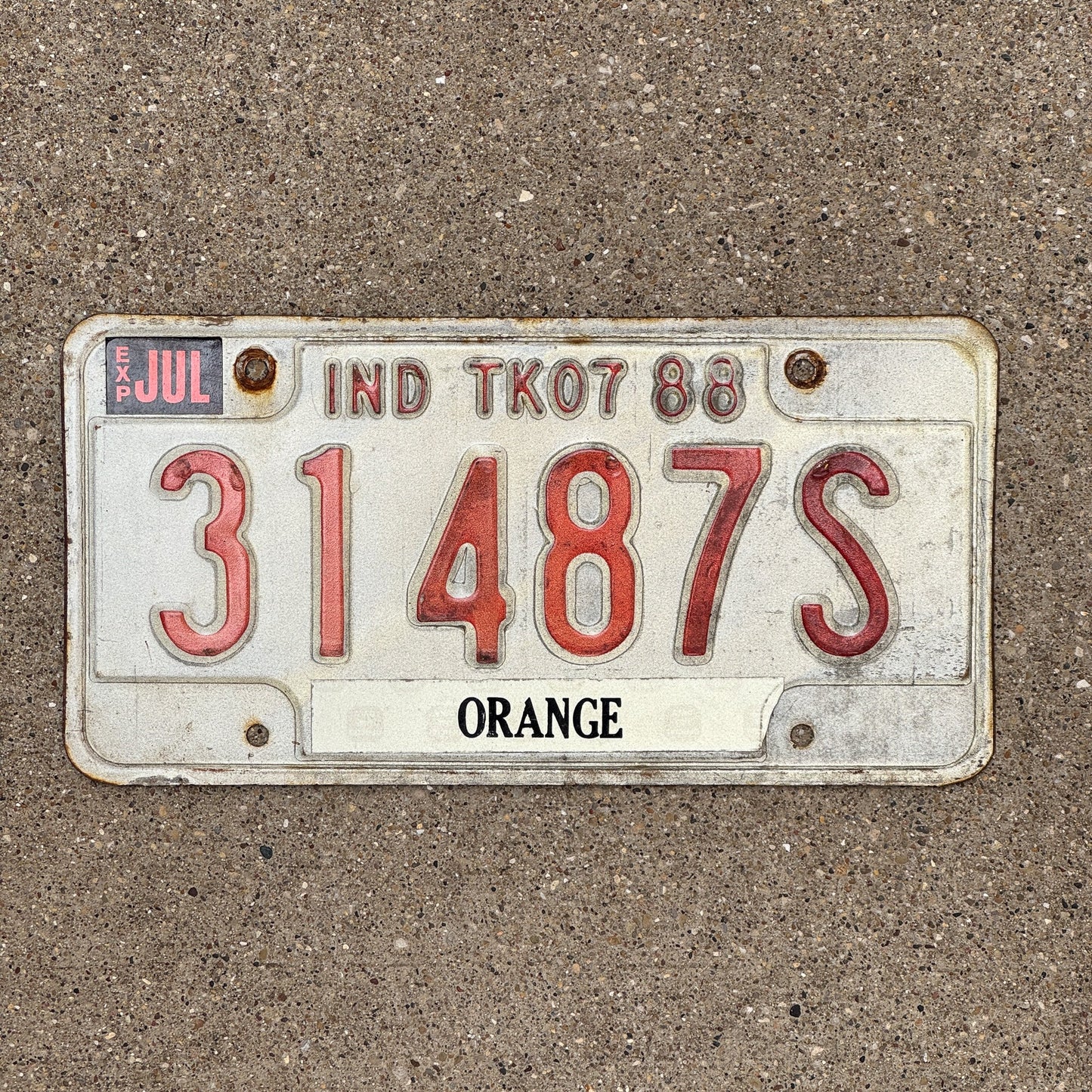 Photo of a 1988 Indiana TRUCK 7 License Plate Auto Tag Garage Decor Vintage Orange County 31487 S