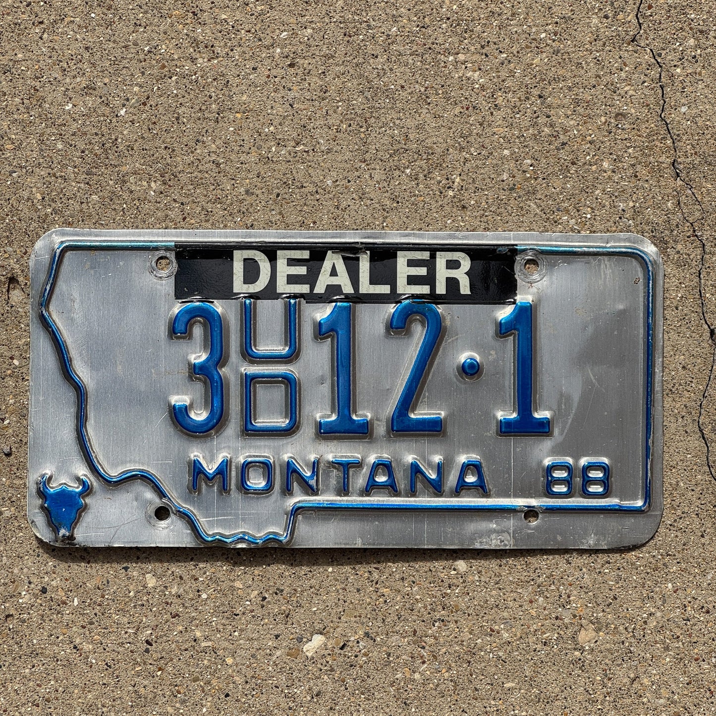 Photo of a 1988 Montana Dealer License Plate Auto Tag Garage Decor Vintage 3 UD 12 1