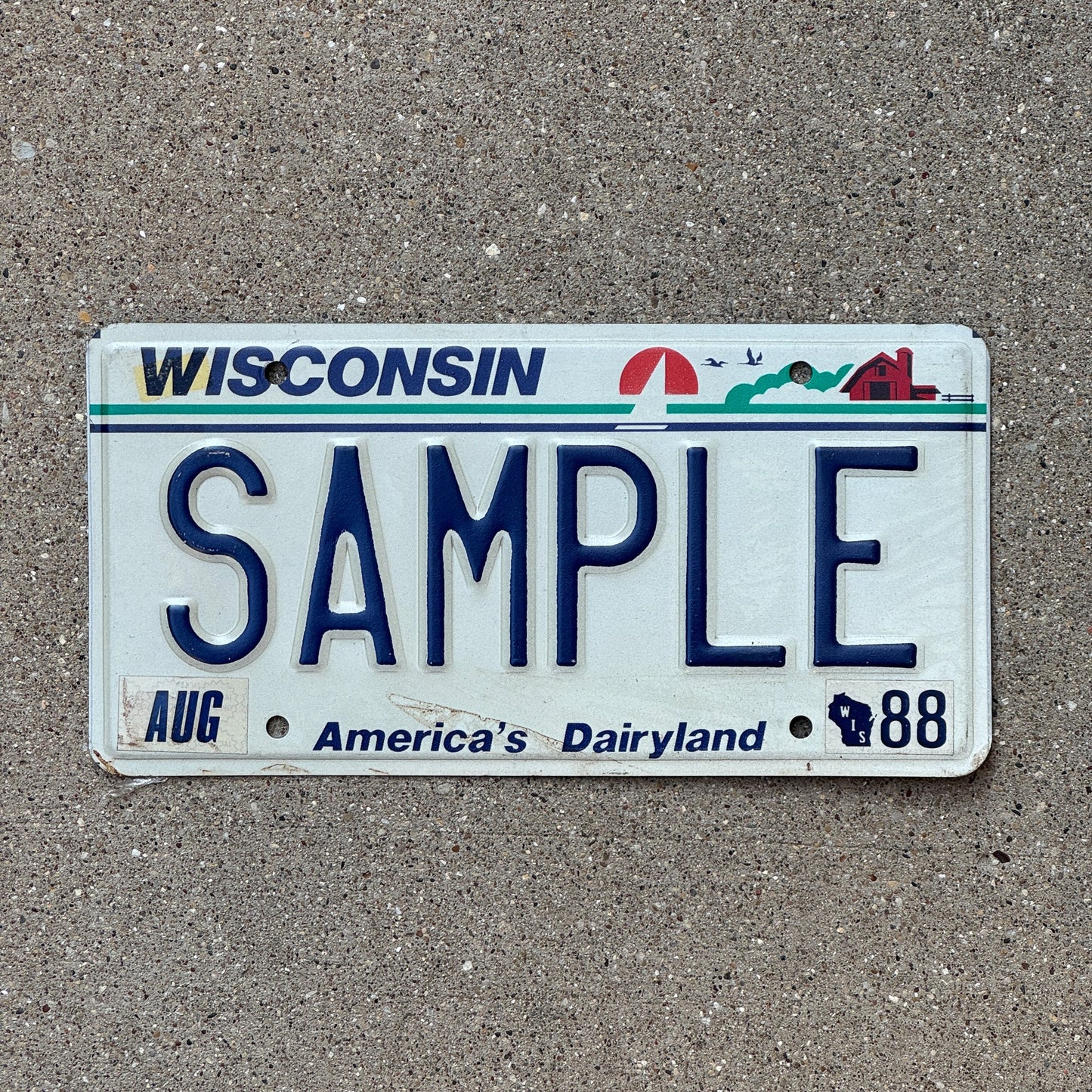 Photo of a 1988 Wisconsin Sample License Plate Auto Tag Garage Decor Vintage SAMPLE