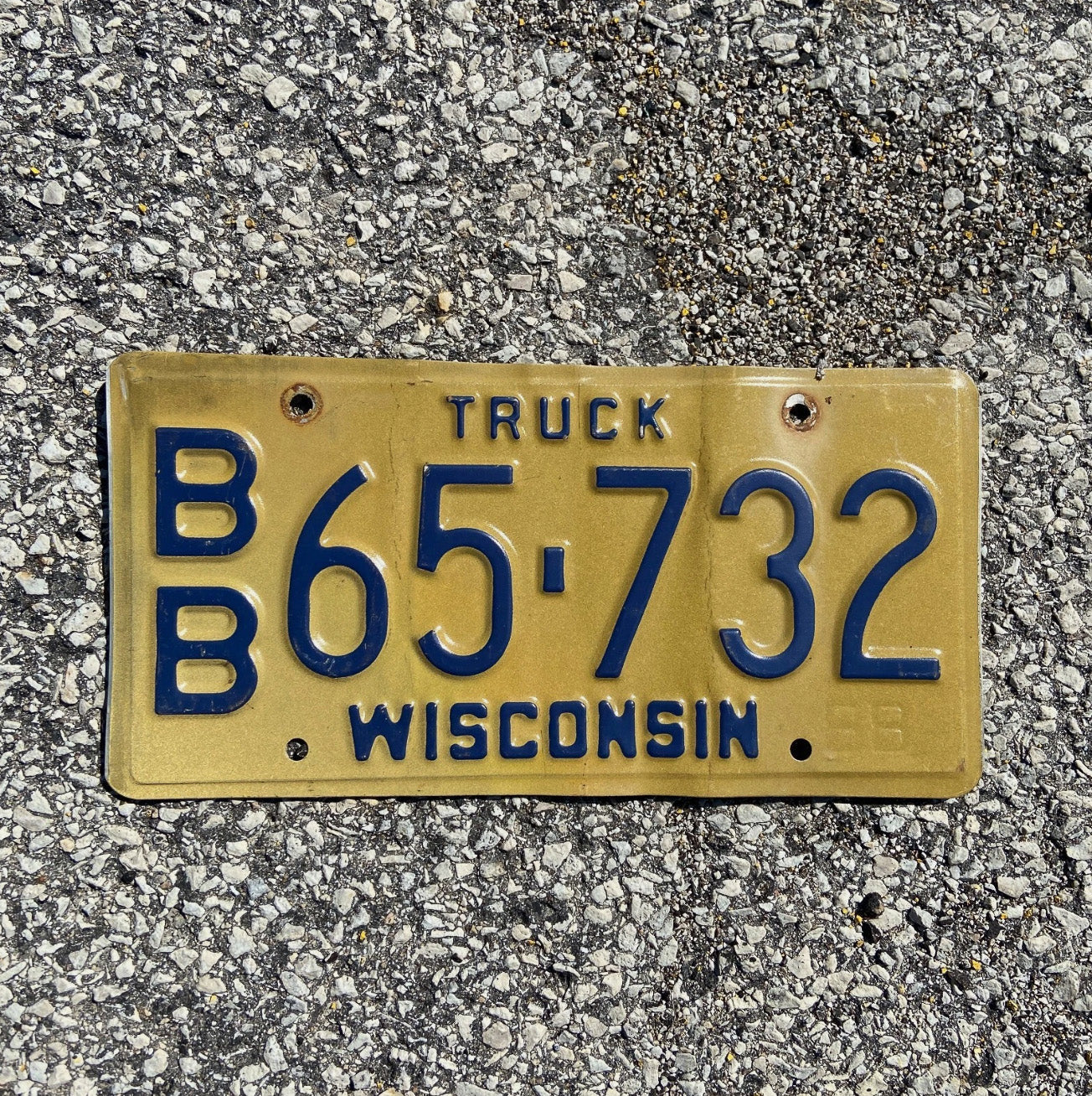 Photo of a 1988 Wisconsin Truck License Plate Auto Tag Garage Decor Vintage BB 65 732