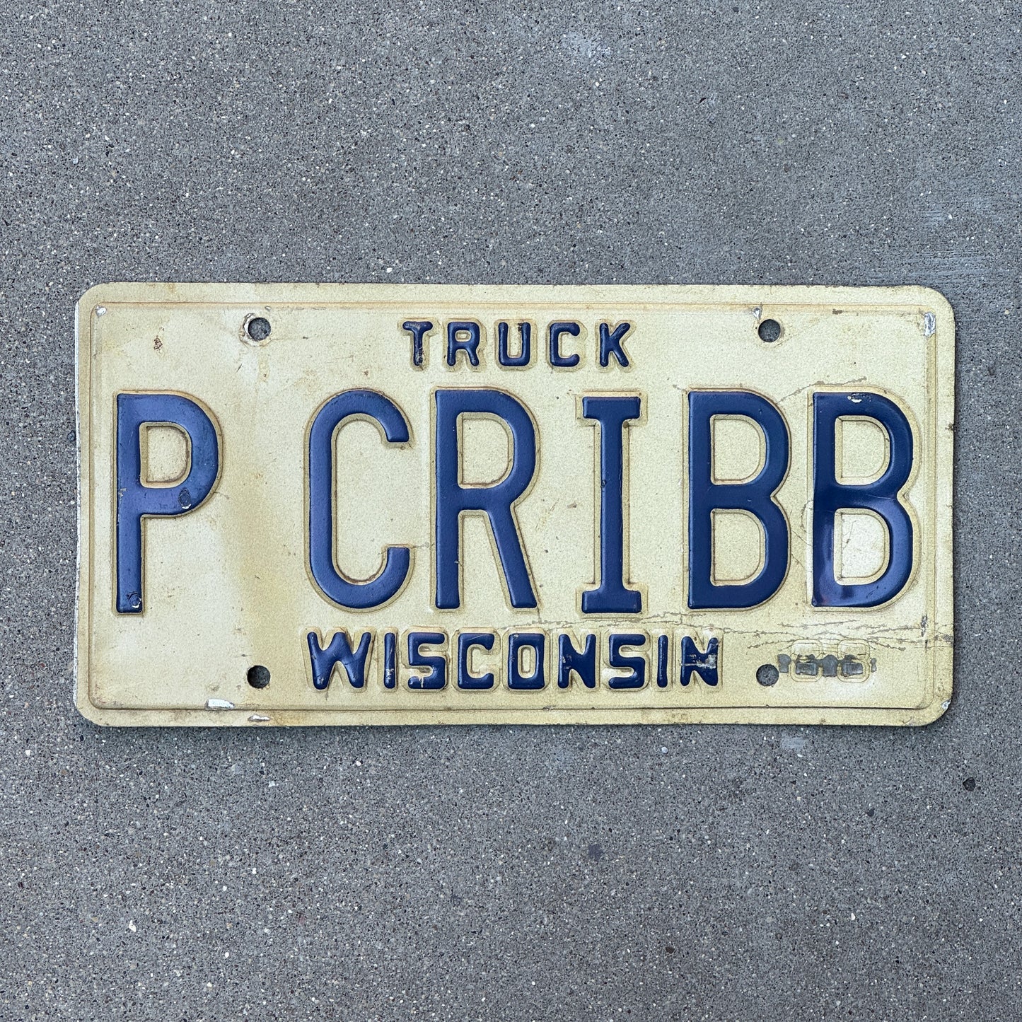 Photo of a 1988 Wisconsin Vanity Truck License Plate Auto Tag Garage Decor Vintage P CRIBB with original patina