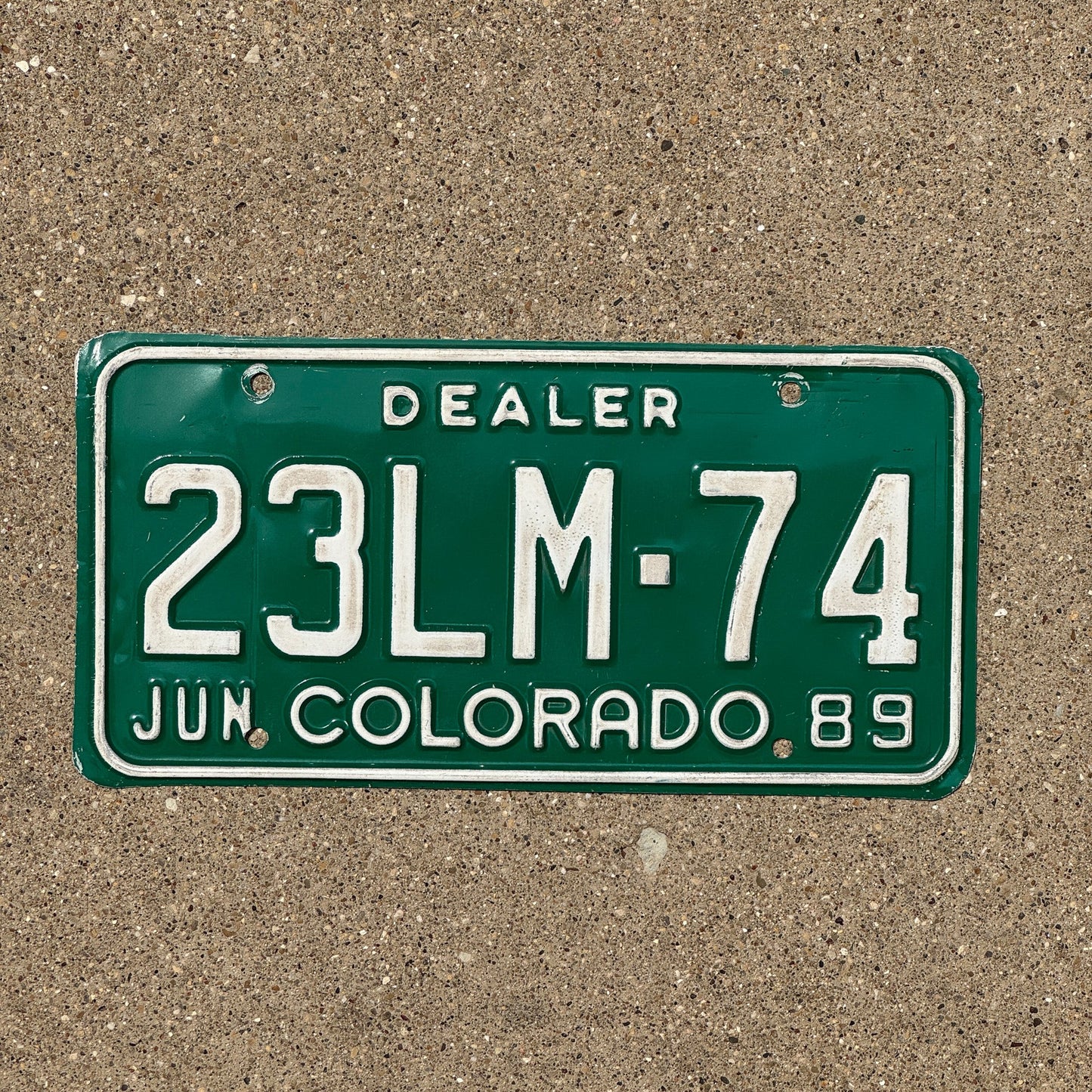 Photo of a 1989 Colorado Dealer License Plate Auto Tag Garage Decor Vintage 23 LM 74