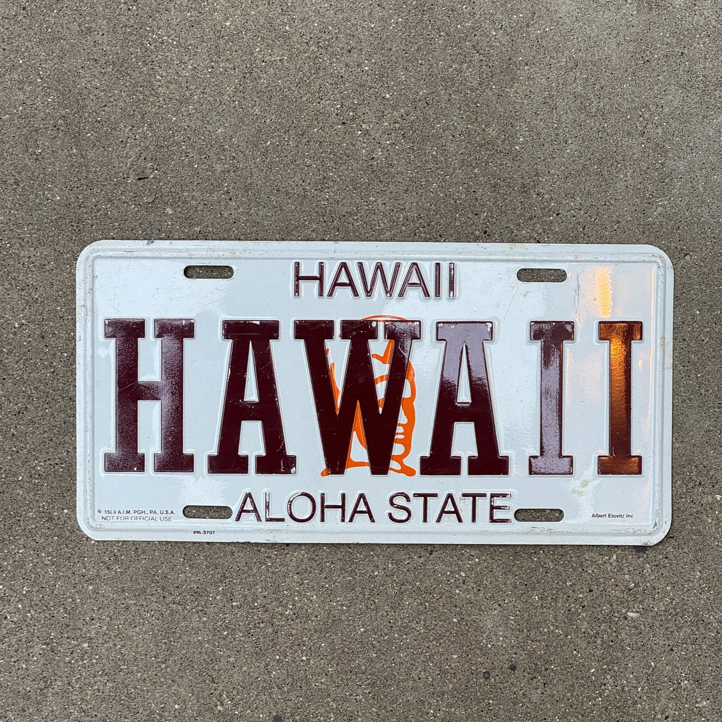 Photo of a 1989 Hawaii Booster License Plate Auto Tag Garage Decor Vintage HAWAII