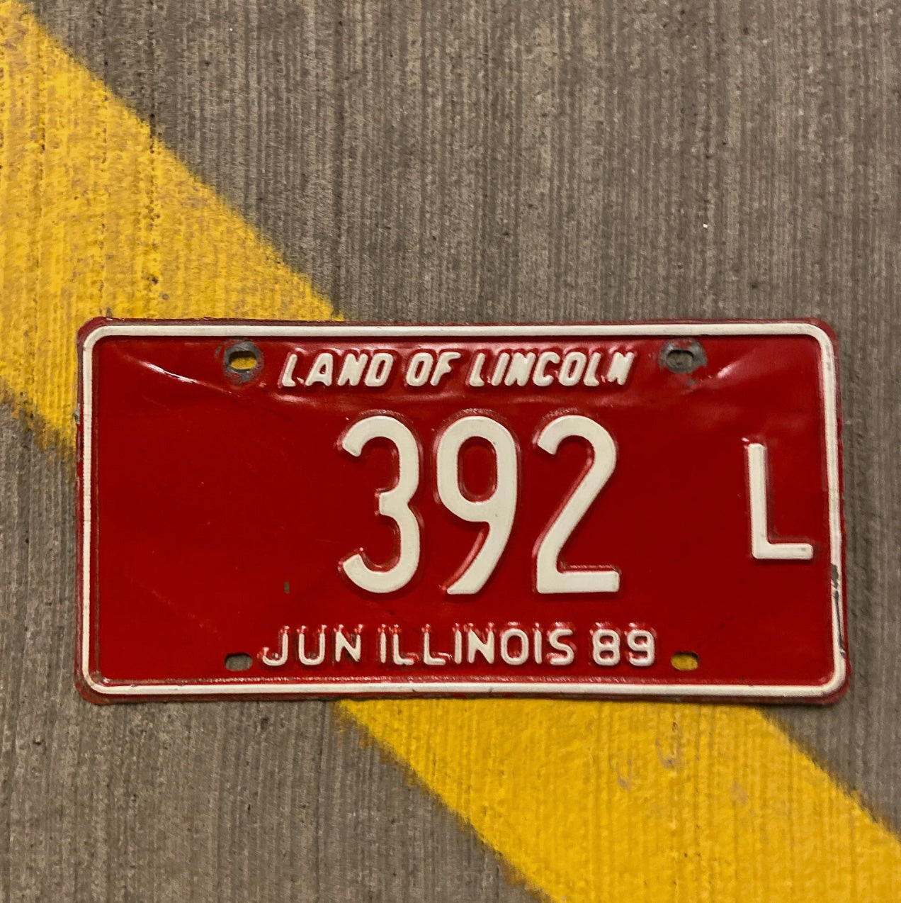 Photo of a 1989 Illinois Truck License Plate Auto Tag Garage Decor Vintage 392 L with original patina