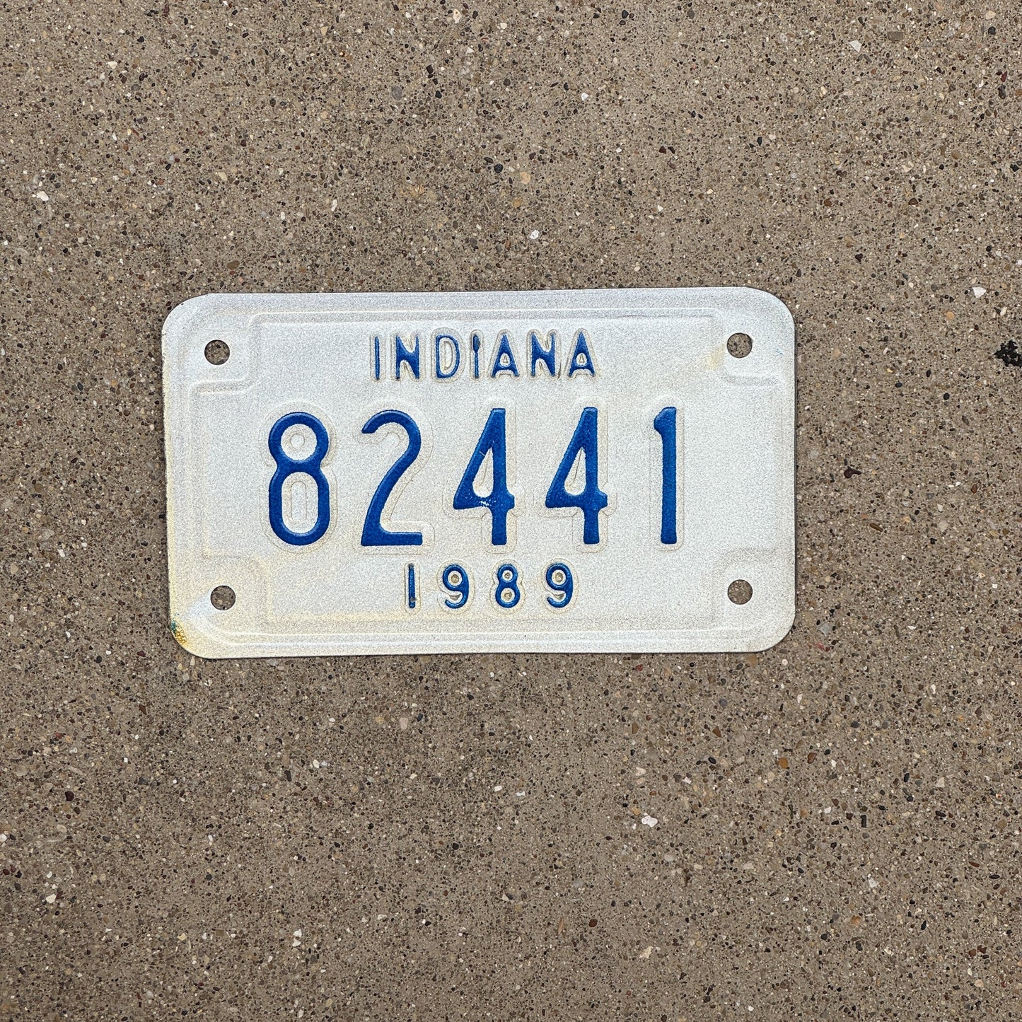Photo of a 1989 Indiana Motorcycle License Plate Auto Tag Garage Decor Vintage 82441