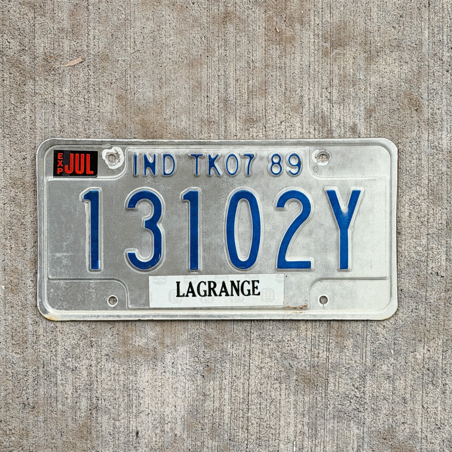 Photo of a 1989 Indiana Truck License Plate Auto Tag Garage Decor Vintage 13102 Y with original patina