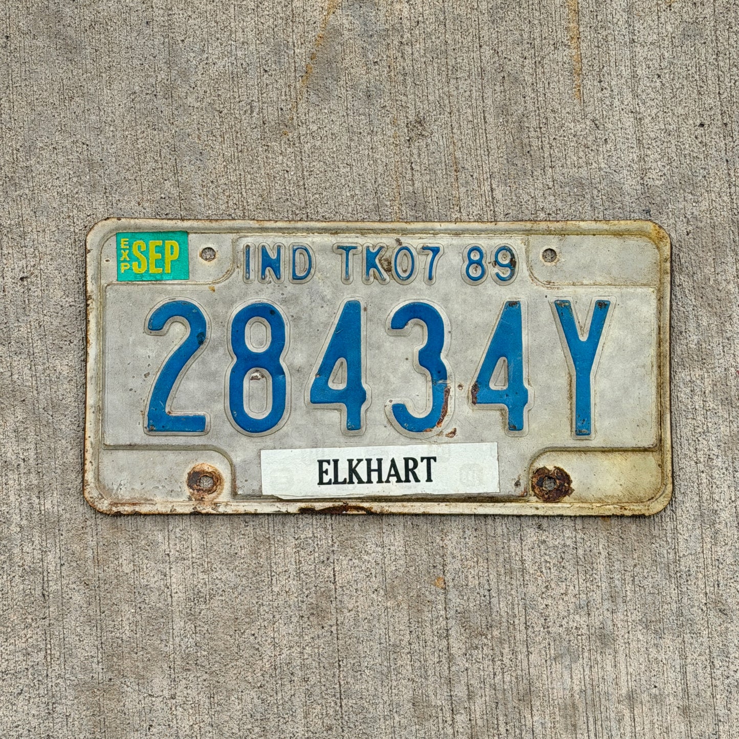 Photo of a 1989 Indiana Truck License Plate Auto Tag Garage Decor Vintage 28434Y with original patina