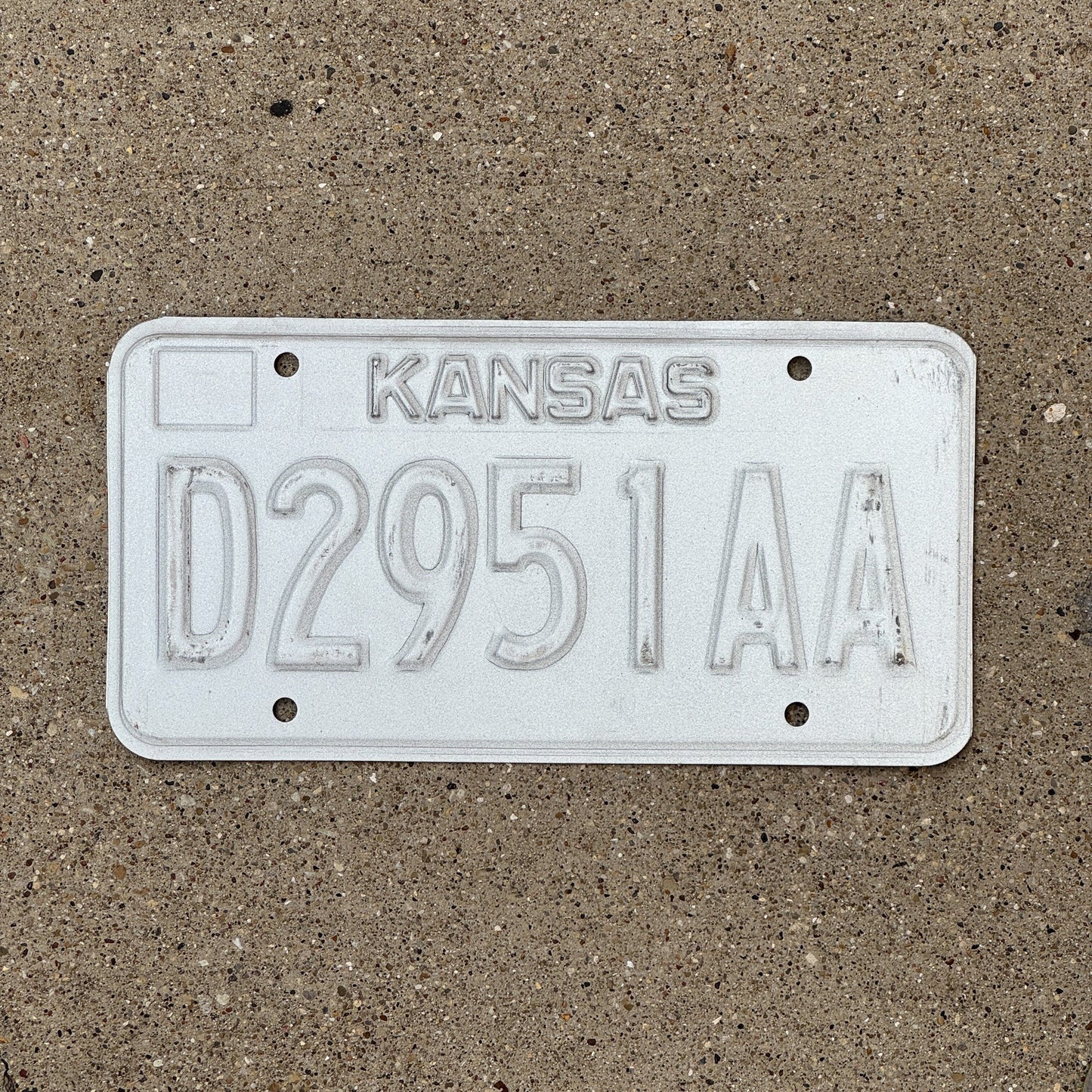 Photo of a 1989 Kansas Dealer Error License Plate Auto Tag Garage Decor Vintage Misprint D 2951 AA