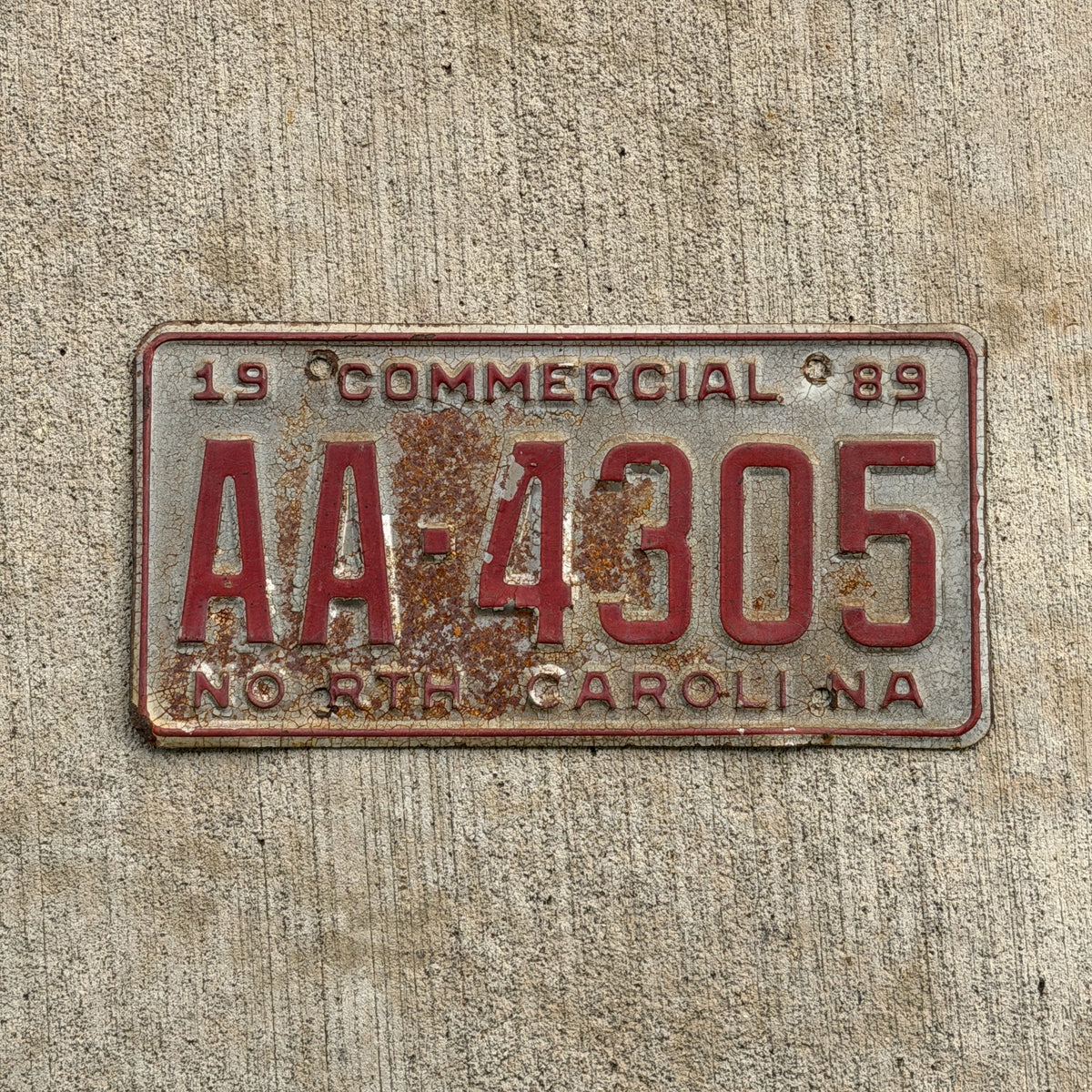 Photo of a 1989 North Carolina Commercial License Plate Auto Tag Garage Decor Vintage AA Block Early Issue AA 4305 with original patina