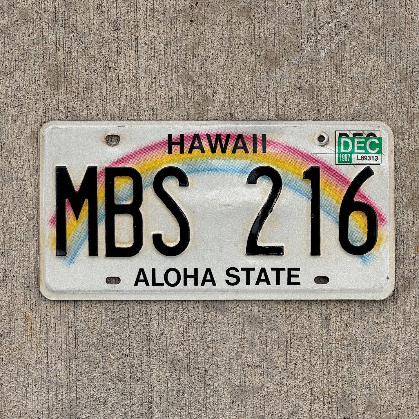 Photo of a 1990 1997 Hawaii License Plate Auto Tag Garage Decor Vintage Rainbow MBS 216 with original patina
