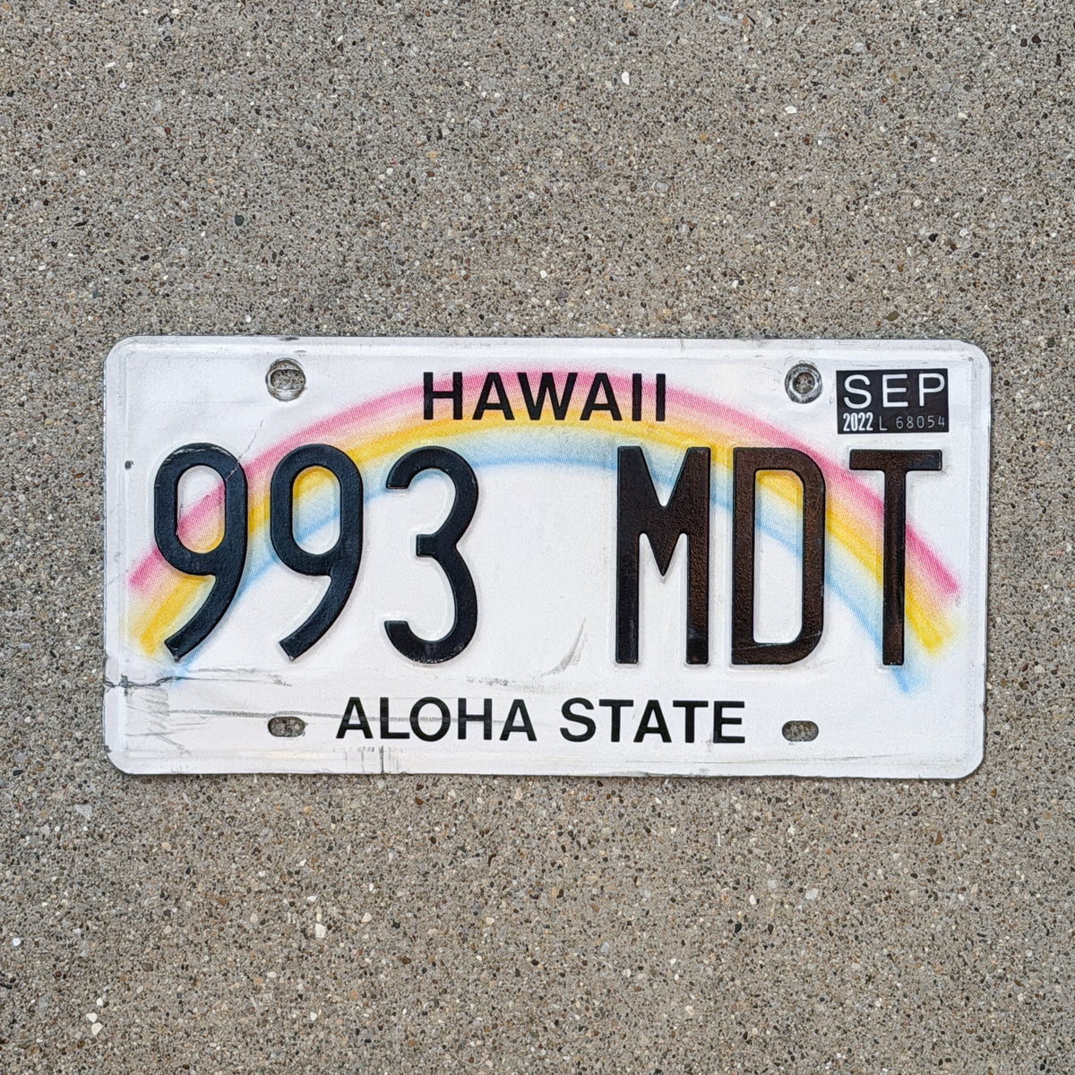 Photo of a 1990 2022 Hawaii License Plate Auto Tag Garage Decor Vintage Rainbow 993 MDT with original patina