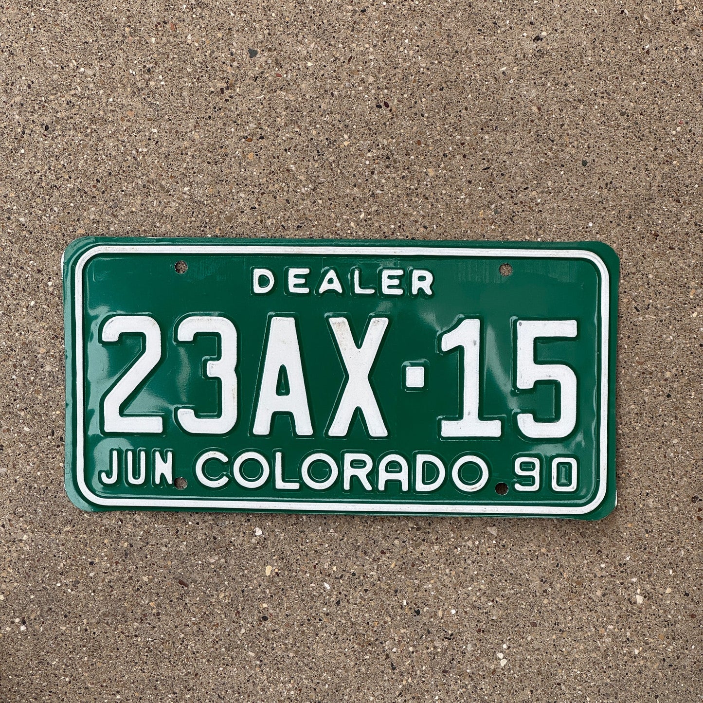 Photo of a 1990 Colorado Dealer License Plate Auto Tag Garage Decor Vintage 23 AX 15