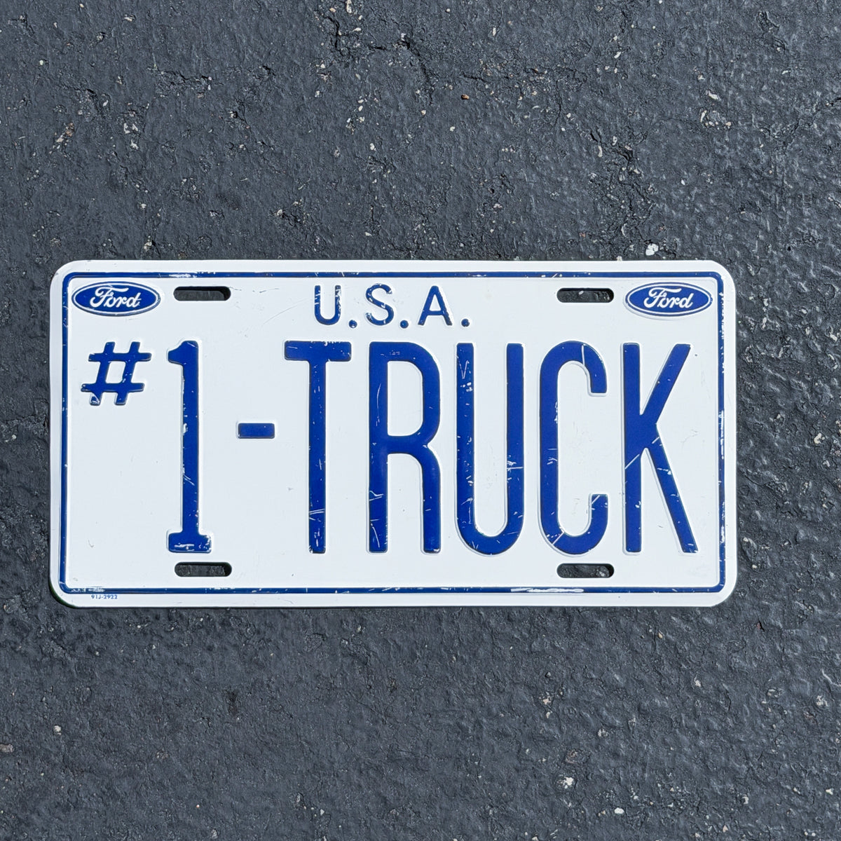 Photo of a 1990 Era Ford #1 TRUCK Booster License Plate Auto Tag Garage Decor Vintage
USA Metal with original patina