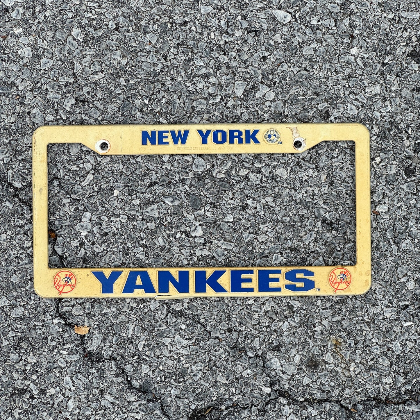 Photo of a 1990 Era New York License Plate Frame Auto Tag Garage Decor Vintage Plastic Yankees MLB