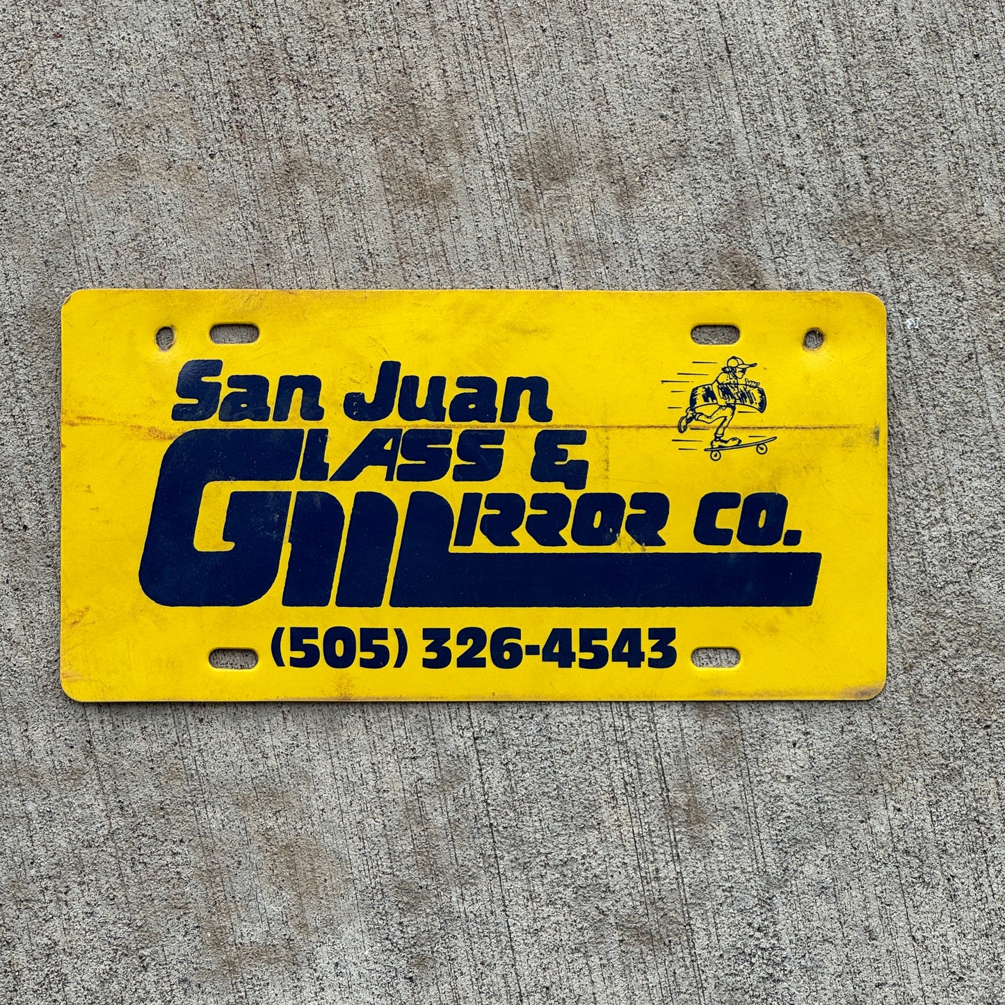 Photo of a 1990 Era San Juan Glass Mirror Co New Mexico Booster License Plate Auto Tag Garage Decor Vintage Flimsy Plastic with original patina