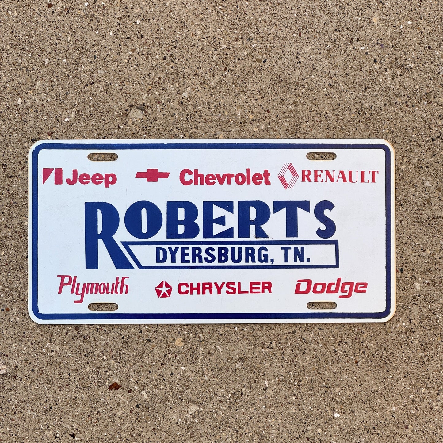 Photo of a 1990 Era Tennessee Dealer Booster License Plate Auto Tag 2 Garage Decor Dyersburg TN Plastic ROBERTS with original patina
