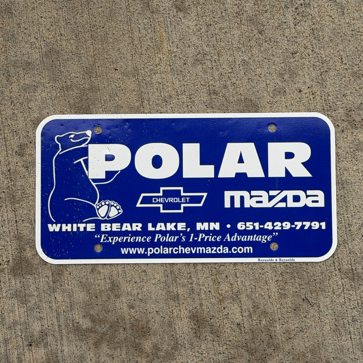 Photo of a 1990 Era White Bear Lake Minnesota Booster License Plate Auto Tag Garage Decor Vintage Polar Mazda Plastic with original patina