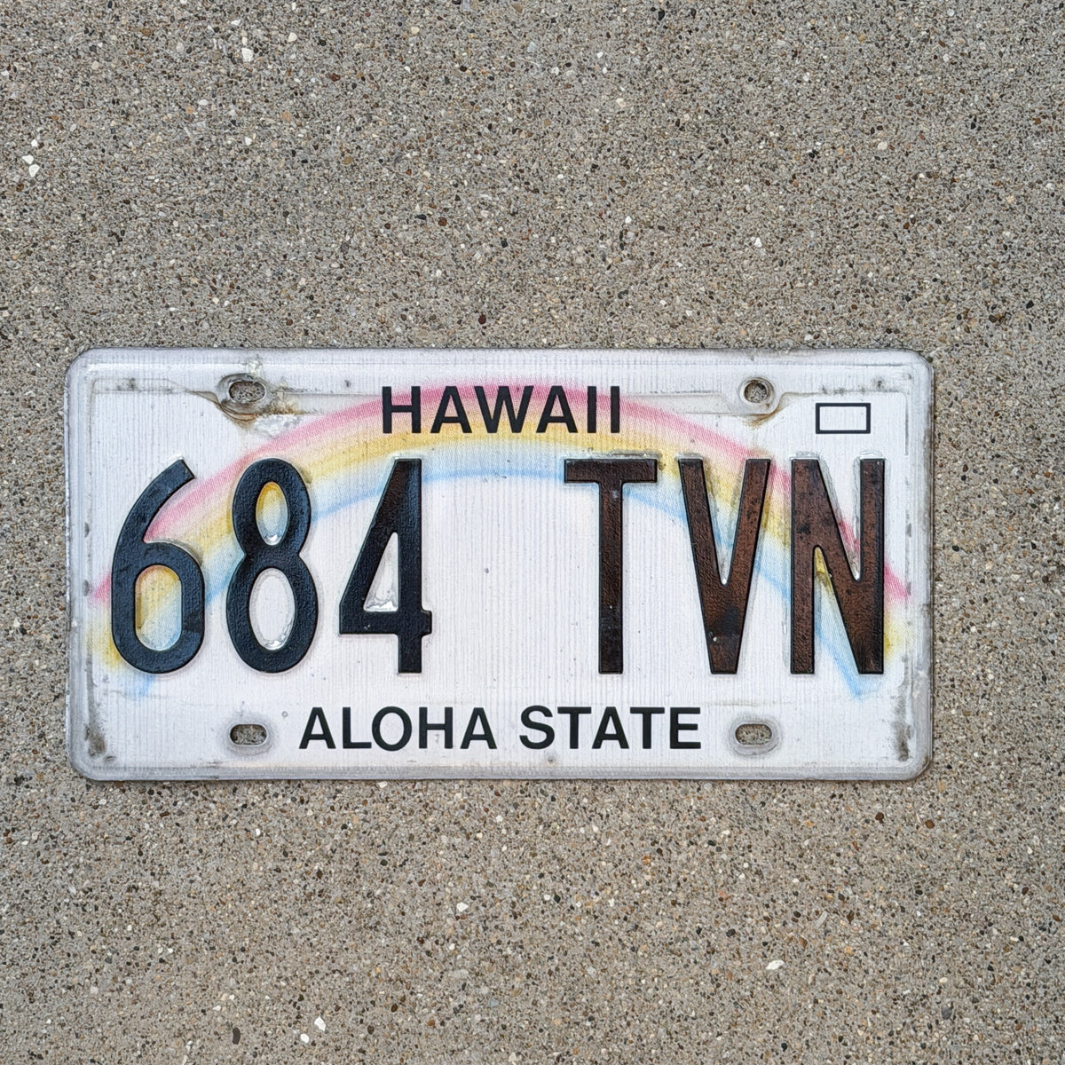 Photo of a 1990 Hawaii License Plate Auto Tag Garage Decor Vintage Rainbow 684 TVN with original patina