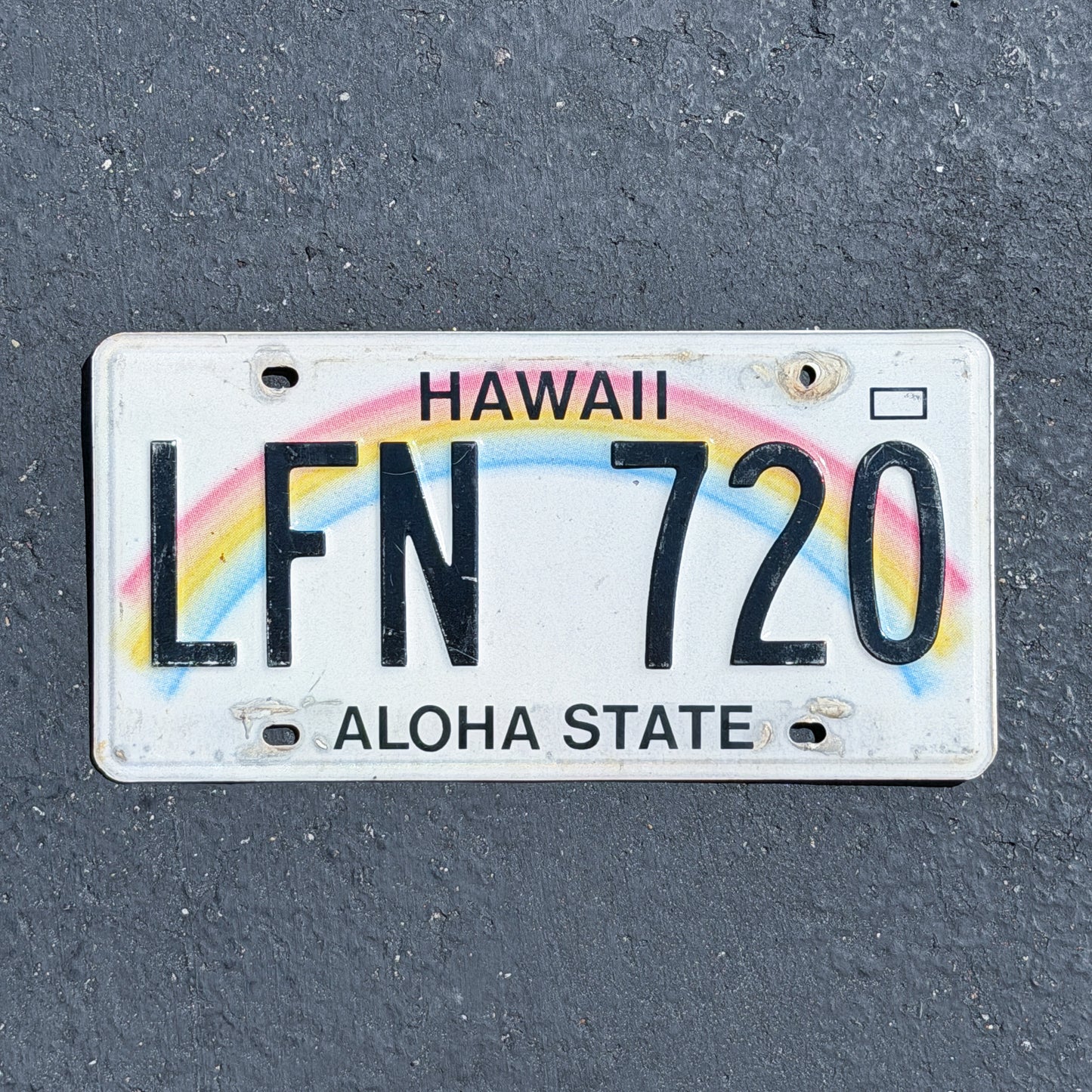 Photo of a 1990 Hawaii License Plate Auto Tag Garage Decor Vintage Rainbow LFN 720 with original patina