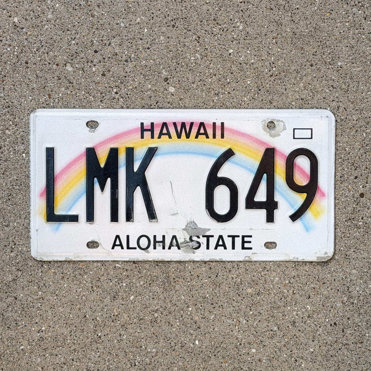 Photo of a 1990 Hawaii License Plate Auto Tag Garage Decor Vintage Rainbow LMK 649 with original patina