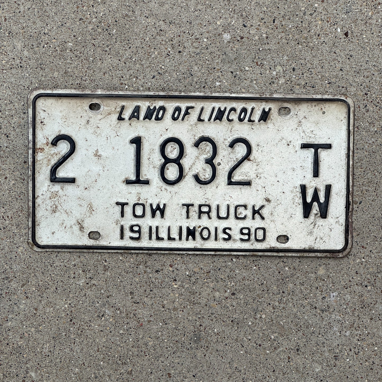 Photo of a 1990 Illinois Tow Truck License Plate Auto Tag 1 Vintage Garage 2 1832 TW with original patina