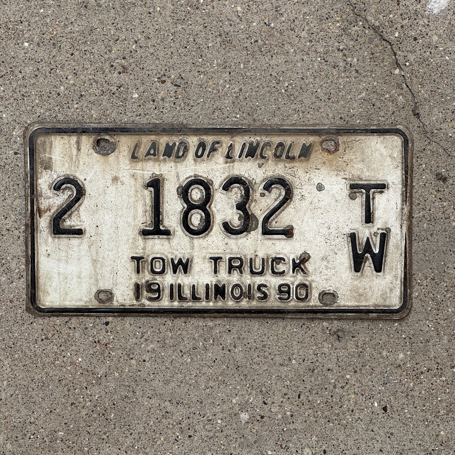 Photo of a 1990 Illinois Tow Truck License Plate Auto Tag 2 Vintage Garage 2 1832 TW with original patina