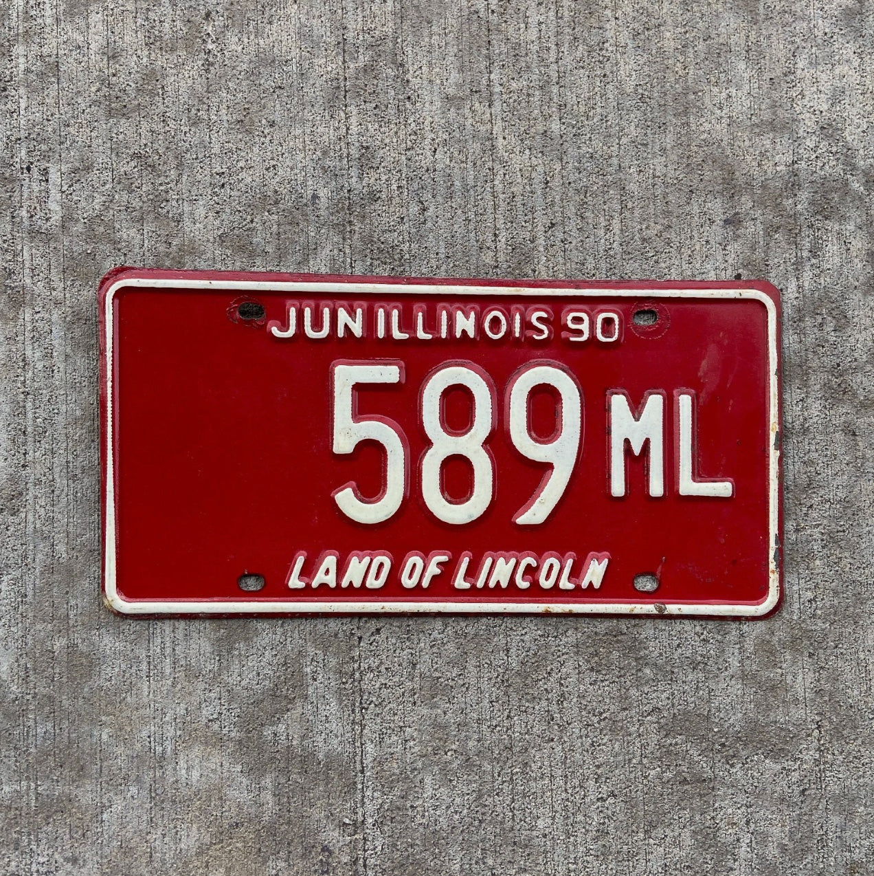 Photo of a 1990 Illinois Truck Mileage Tax License Plate Auto Tag Garage Decor Vintage 589 ML with original patina