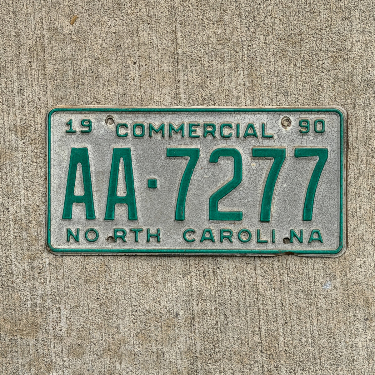 Photo of a 1990 North Carolina Commercial License Plate Auto Tag Garage Decor Vintage AA Block Early Issue AA 7277 with original patina
