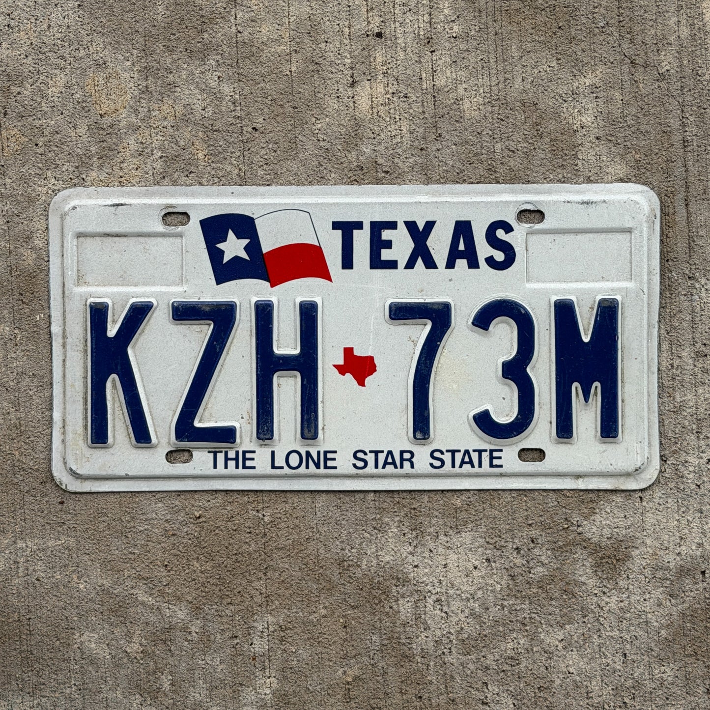 Photo of a 1990 Texas License Plate Auto Tag Garage Decor Vintage KZH 73M with original patina