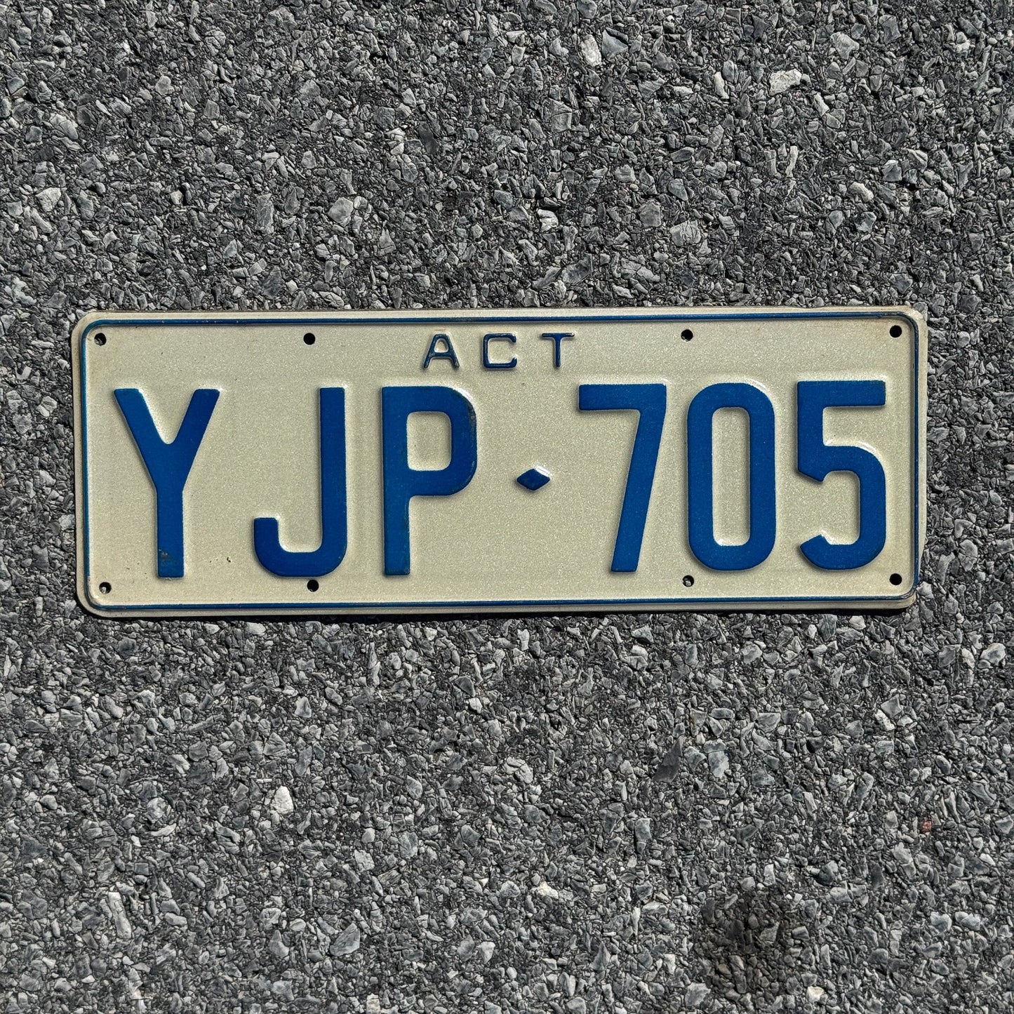 Photo of a 1990s Era Australian Capital Territory License Plate Auto Tag Garage Decor Vintage YJP 705