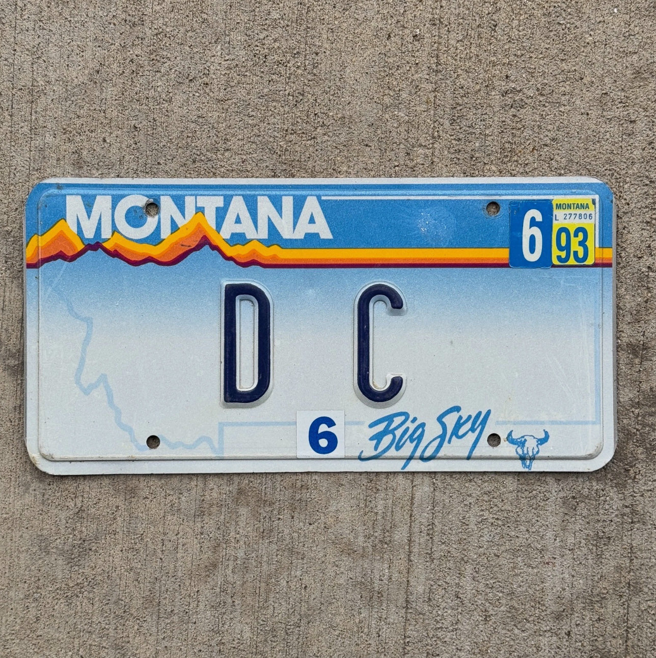Photo of a 1991 1993 Montana Vanity License Plate Auto Tag Garage Decor Vintage Comic Washington DC