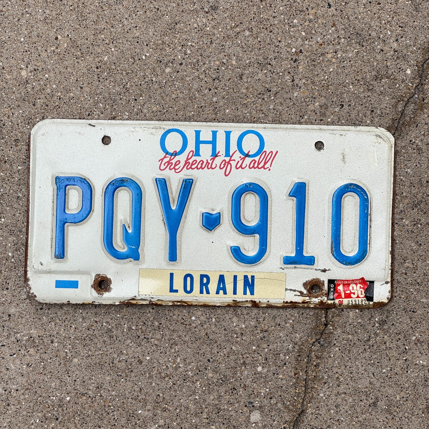 Photo of a 1991 1996 Ohio License Plate Auto Tag 1 Vintage Garage PQY 910 with original patina