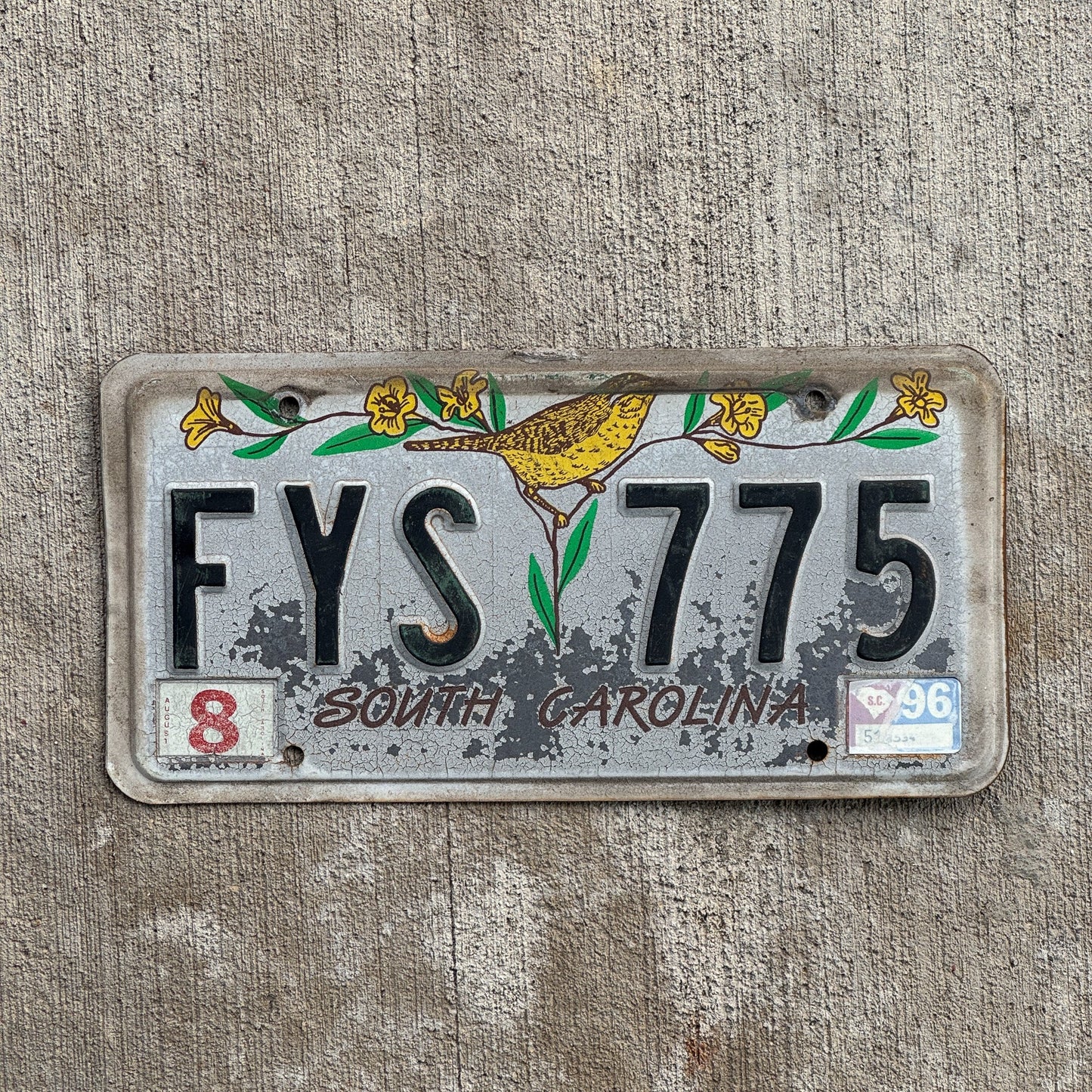 Photo of a 1991 1996 South Carolina License Plate Auto Tag Garage Decor Vintage Bird Floral Decorative FYS 775 with original patina