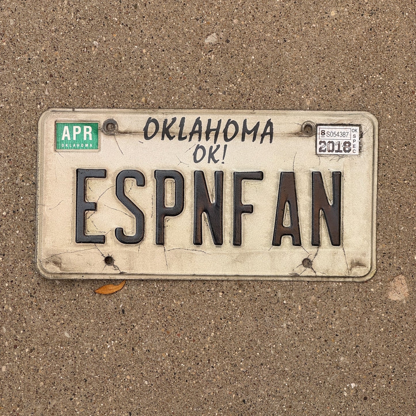 Photo of a 1991 2018 Oklahoma Vanity License Plate Auto Tag Garage Decor Vintage Sports TV Fan ESPN FAN with original patina