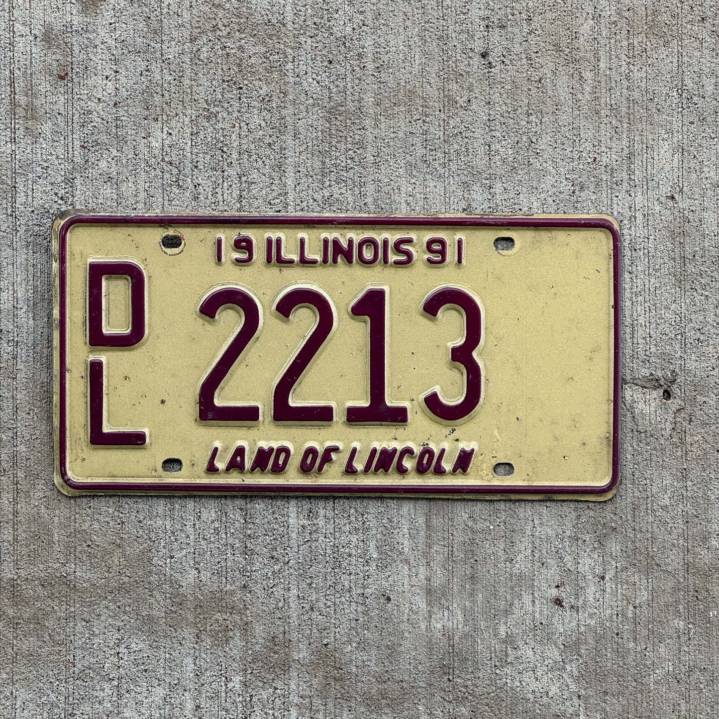 Photo of a 1991 Illinois Dealer License Plate Auto Tag 1 Vintage Garage 2213 with original patina